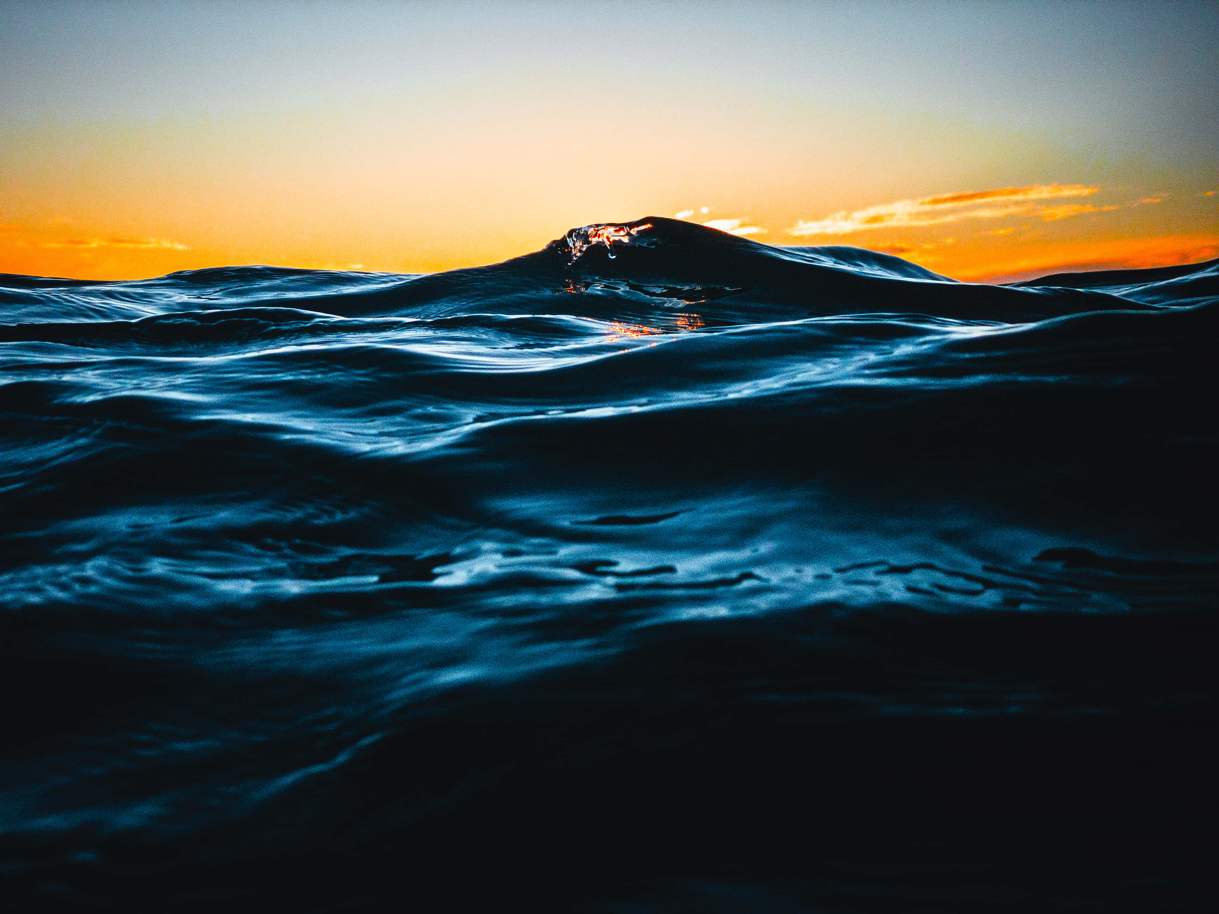 Tumultuous Dark Blue Ocean, sunset, fiery orange sky, 4K Desktop Wallpaper