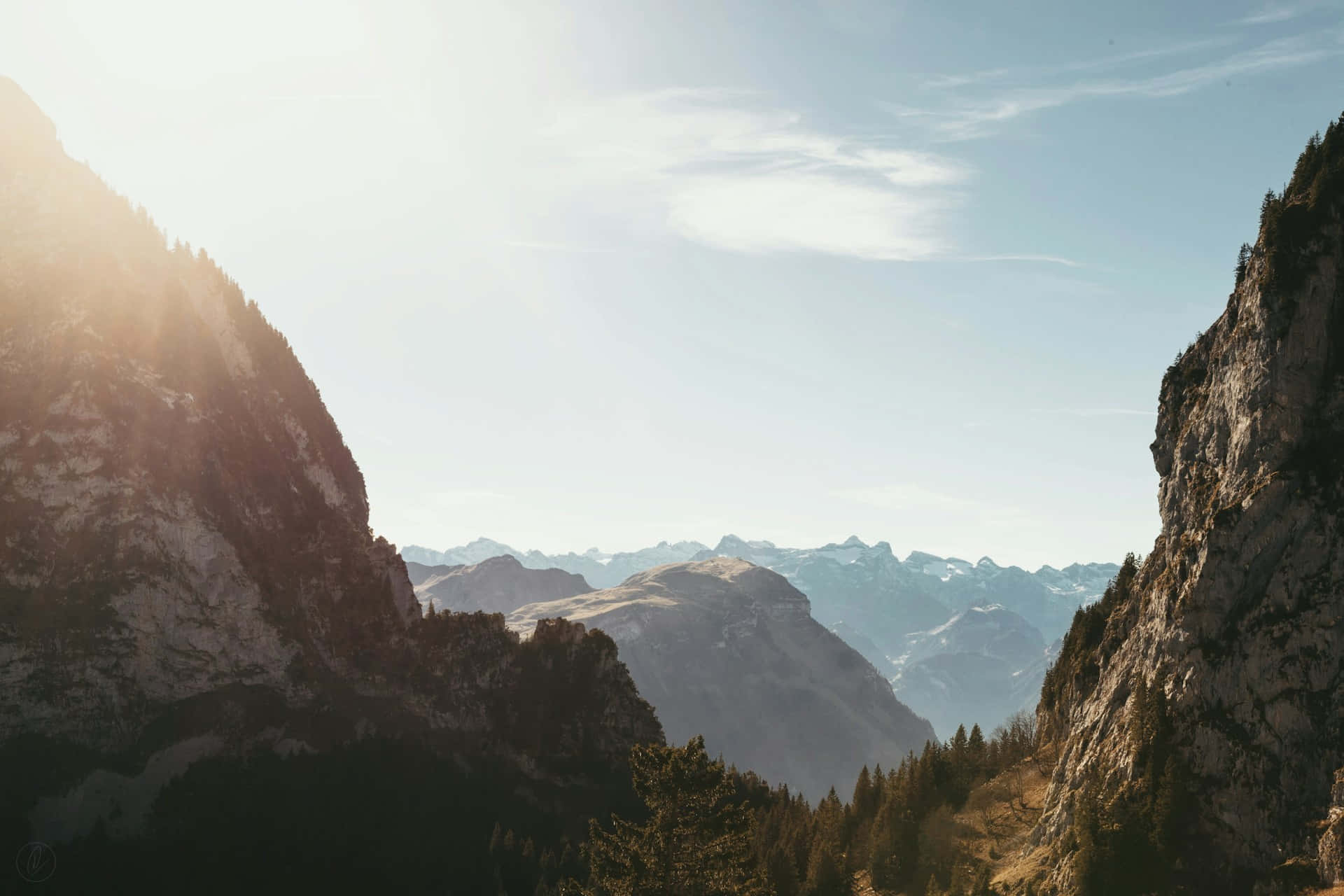 sunlit mountain valley view, narrow mountain pass, snow capped peaks, Full HD Desktop Wallpaper