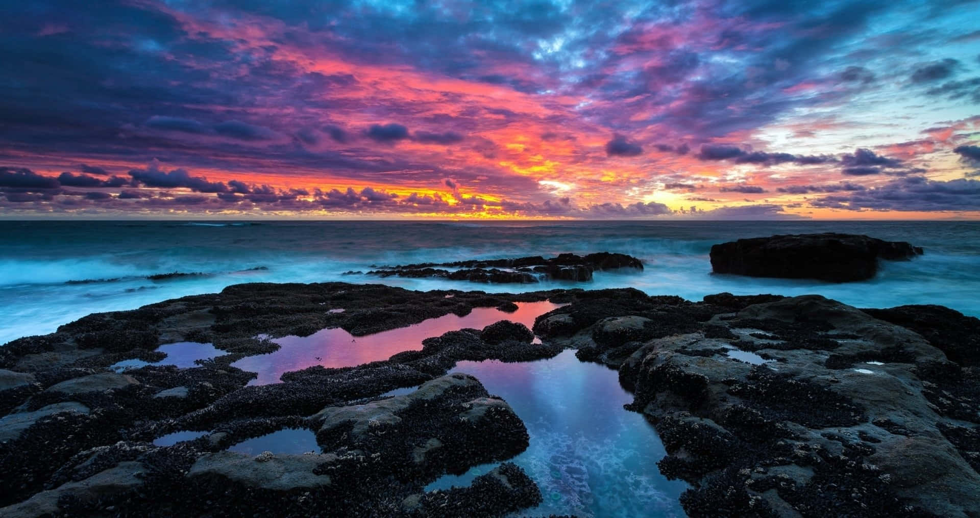 colorful sunset, fiery pinks and purples, rocky shoreline, Full HD Desktop Wallpaper
