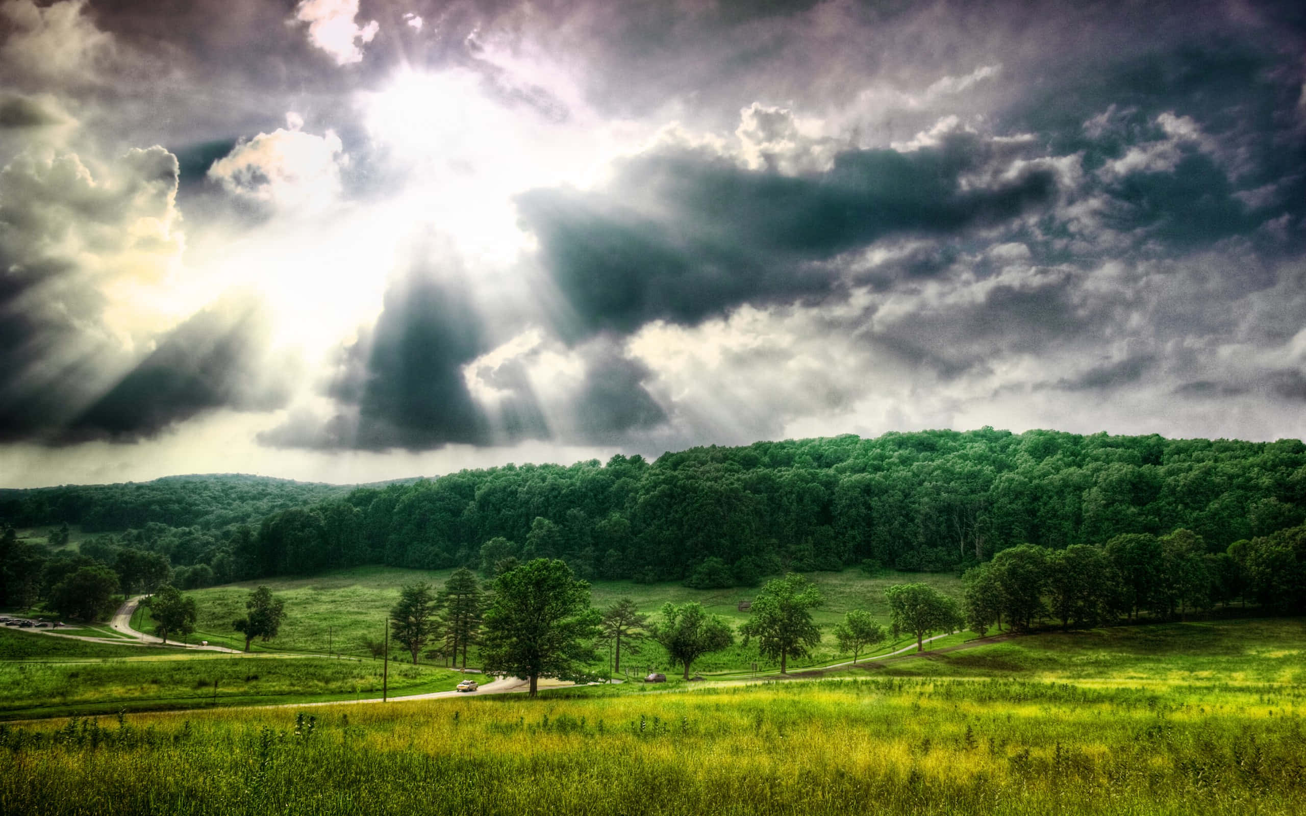 sunlight, dark storm clouds, lush green valley, 2K Desktop Wallpaper