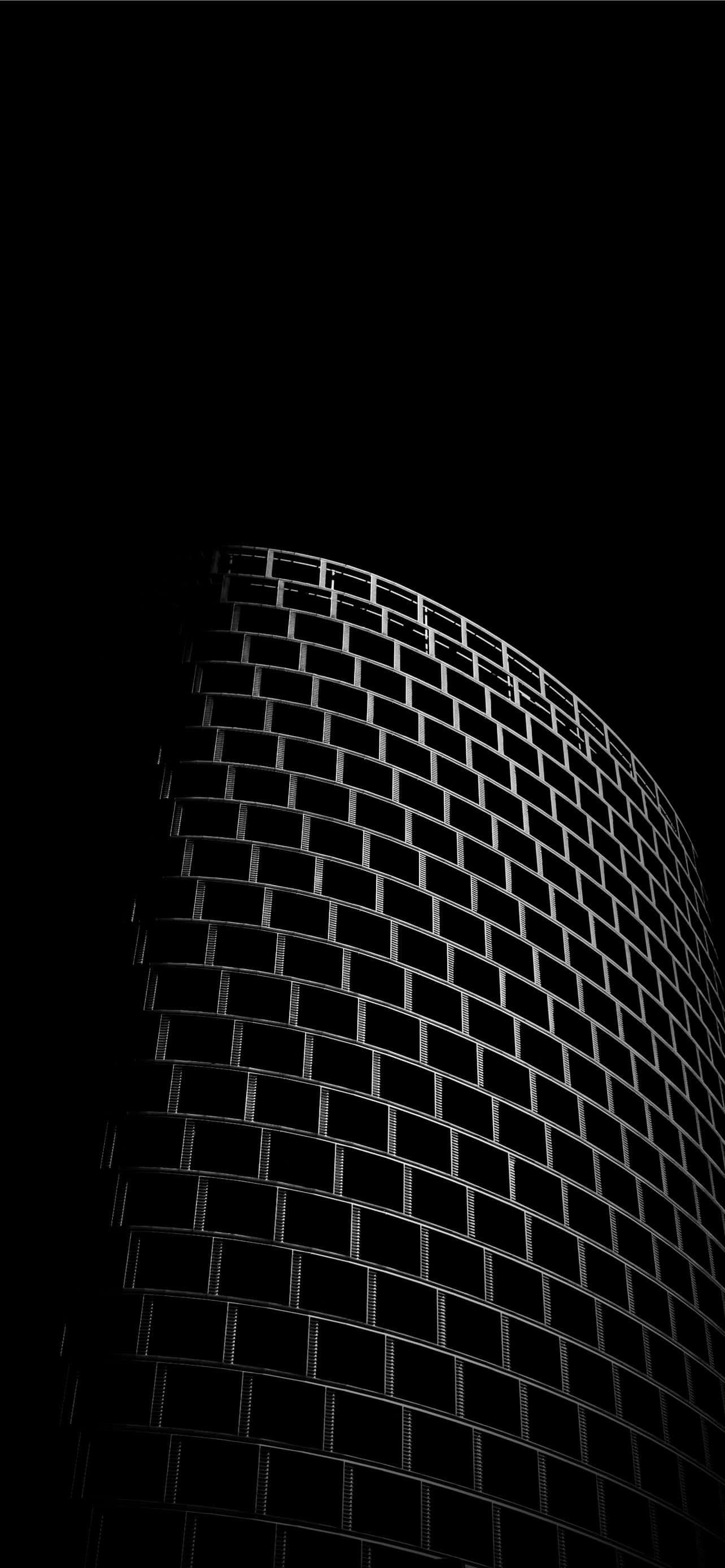 Super Amoled Display, curved glass skyscraper, pitch black night sky, 2K Phone Wallpaper