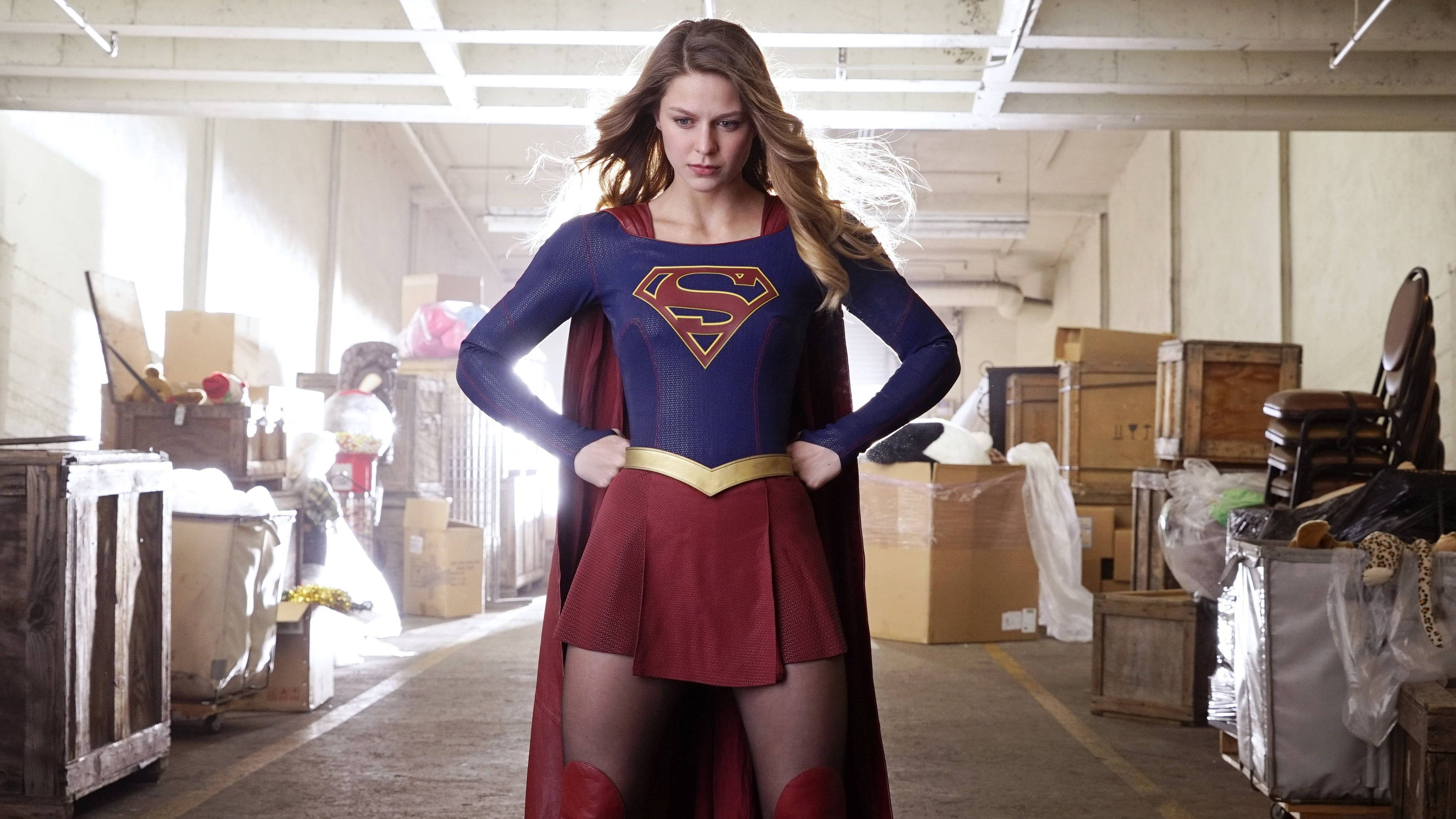 Supergirl, blue and red costume, cluttered warehouse, 4K Desktop Wallpaper