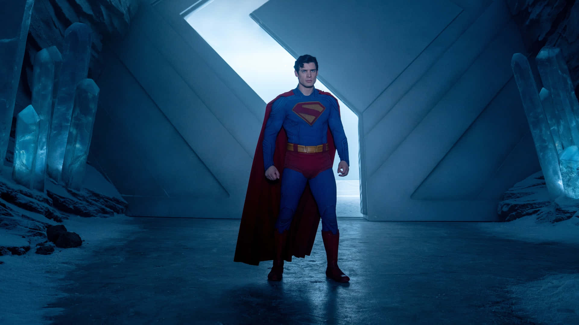 Superman 2025, futuristic blue crystal cavern, glowing geometric architecture, Full HD Desktop Wallpaper