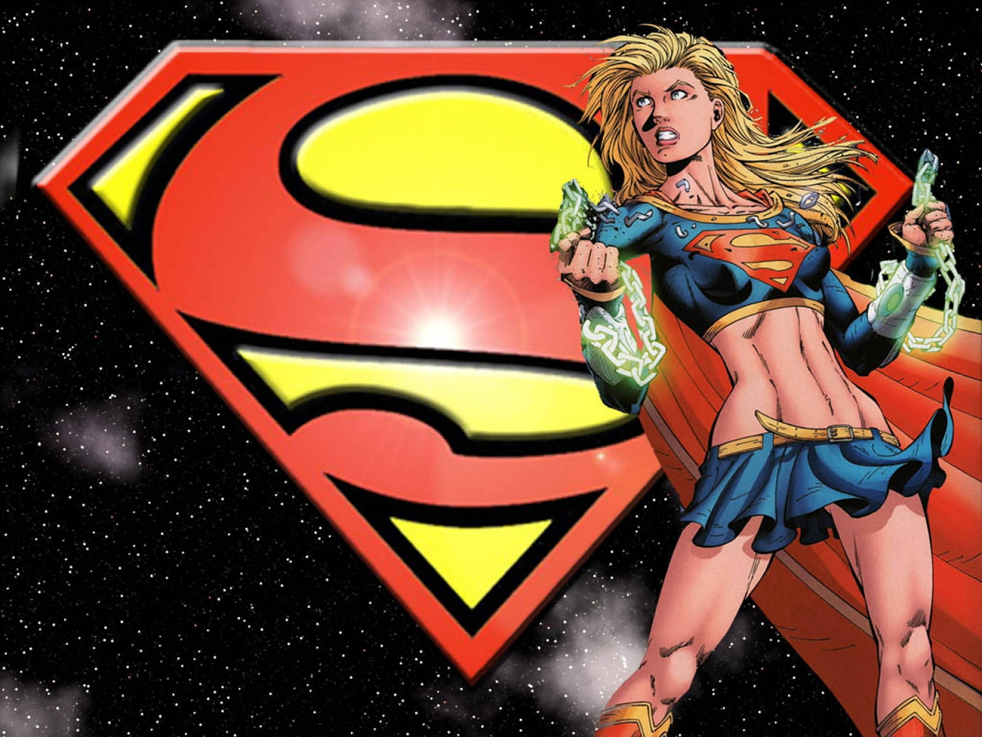 Superwoman, glowing red and yellow S-shield, green energy chains, 2K Desktop Wallpaper