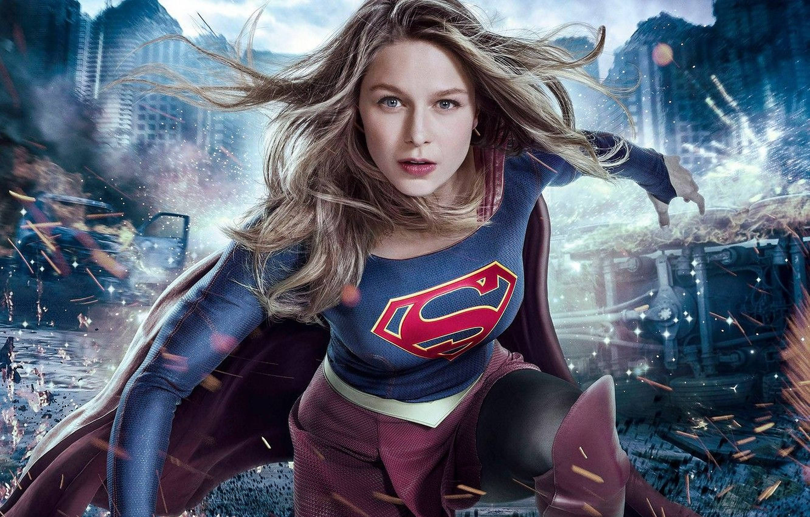 Superwoman, shattered cityscape, debris flying, 2K Desktop Wallpaper