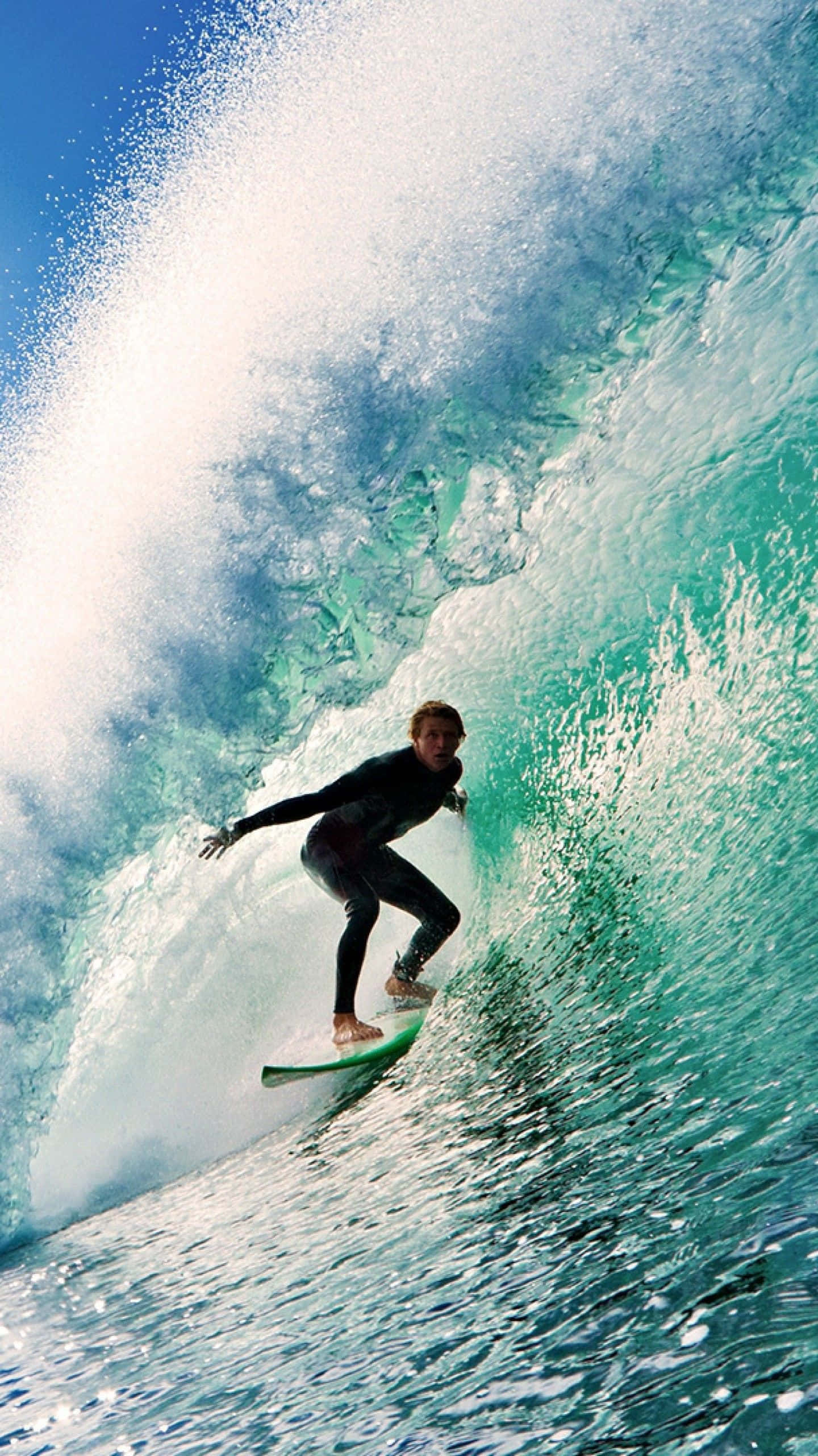 Surfing iPhone, turquoise wave, sunlit spray, 2K Phone Wallpaper