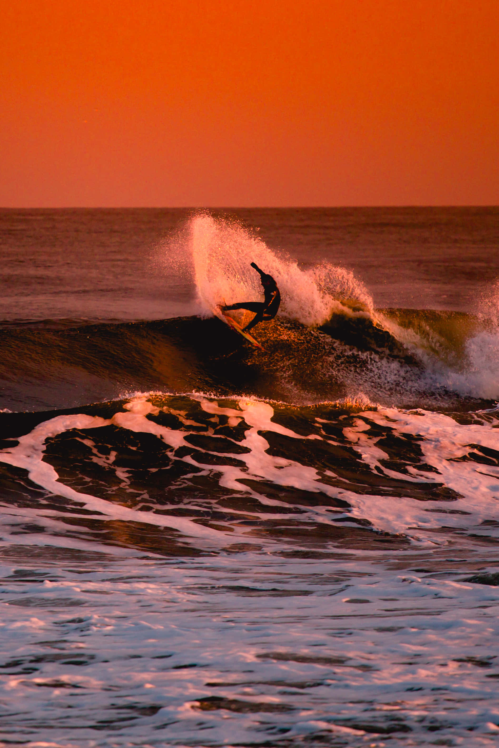 Surfing iPhone, sunset, fiery orange sky, 2K Phone Wallpaper