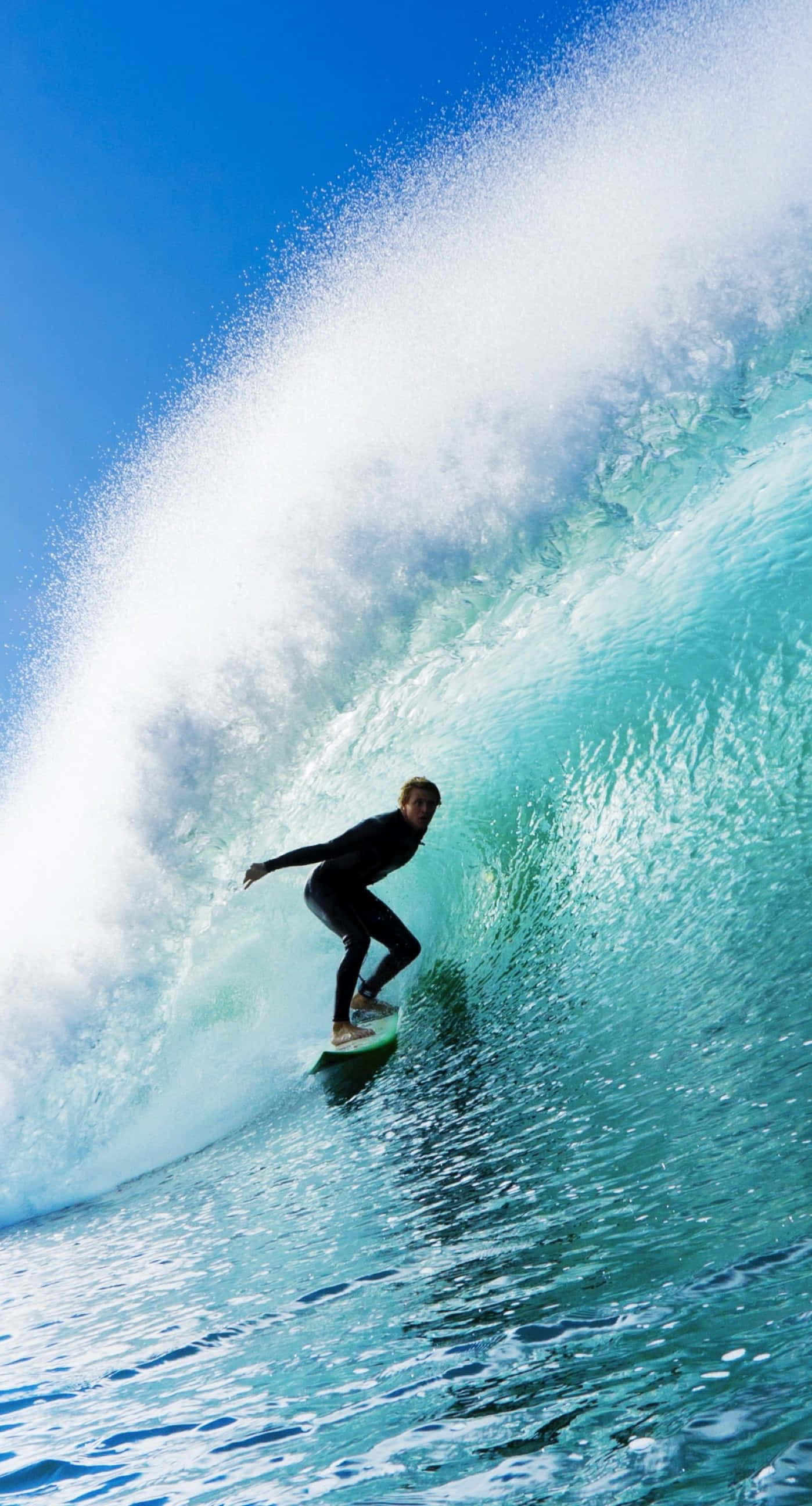 surfing iPhone, black wetsuit, turquoise wave, 2K Phone Wallpaper