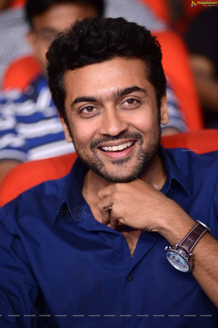 Surya, blue shirt, red chairs, SD Phone Wallpaper