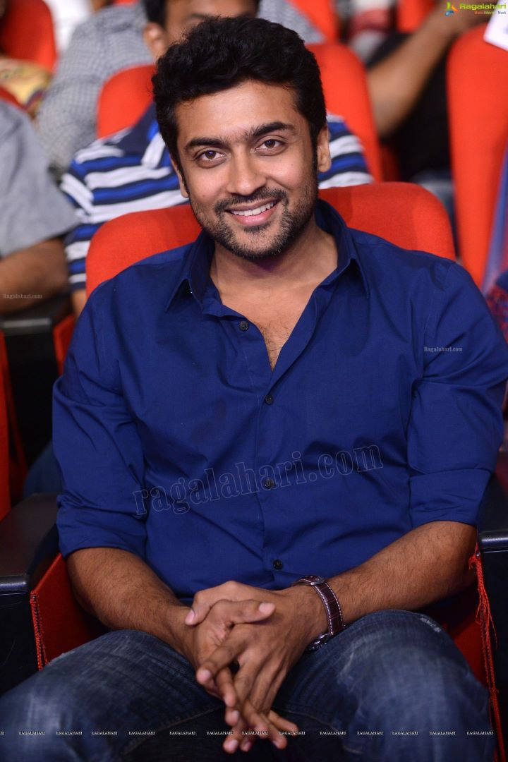 Surya, blue shirt, red theater seat, SD Phone Wallpaper