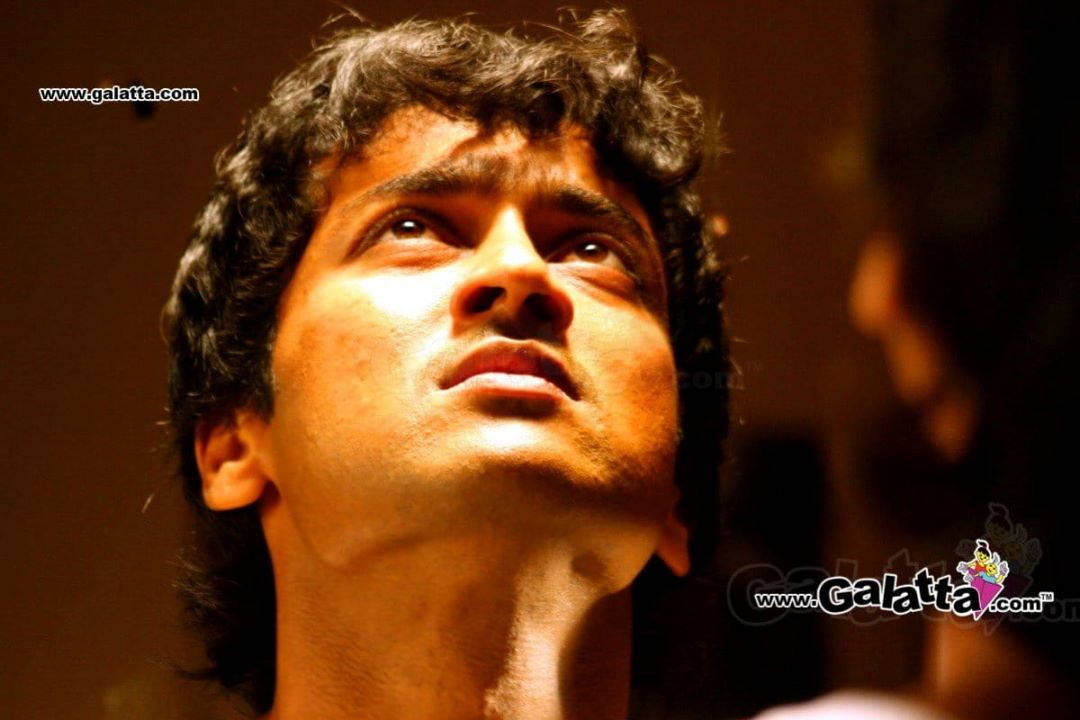 Surya, dark curly hair, warm cinematic lighting, SD Desktop Wallpaper
