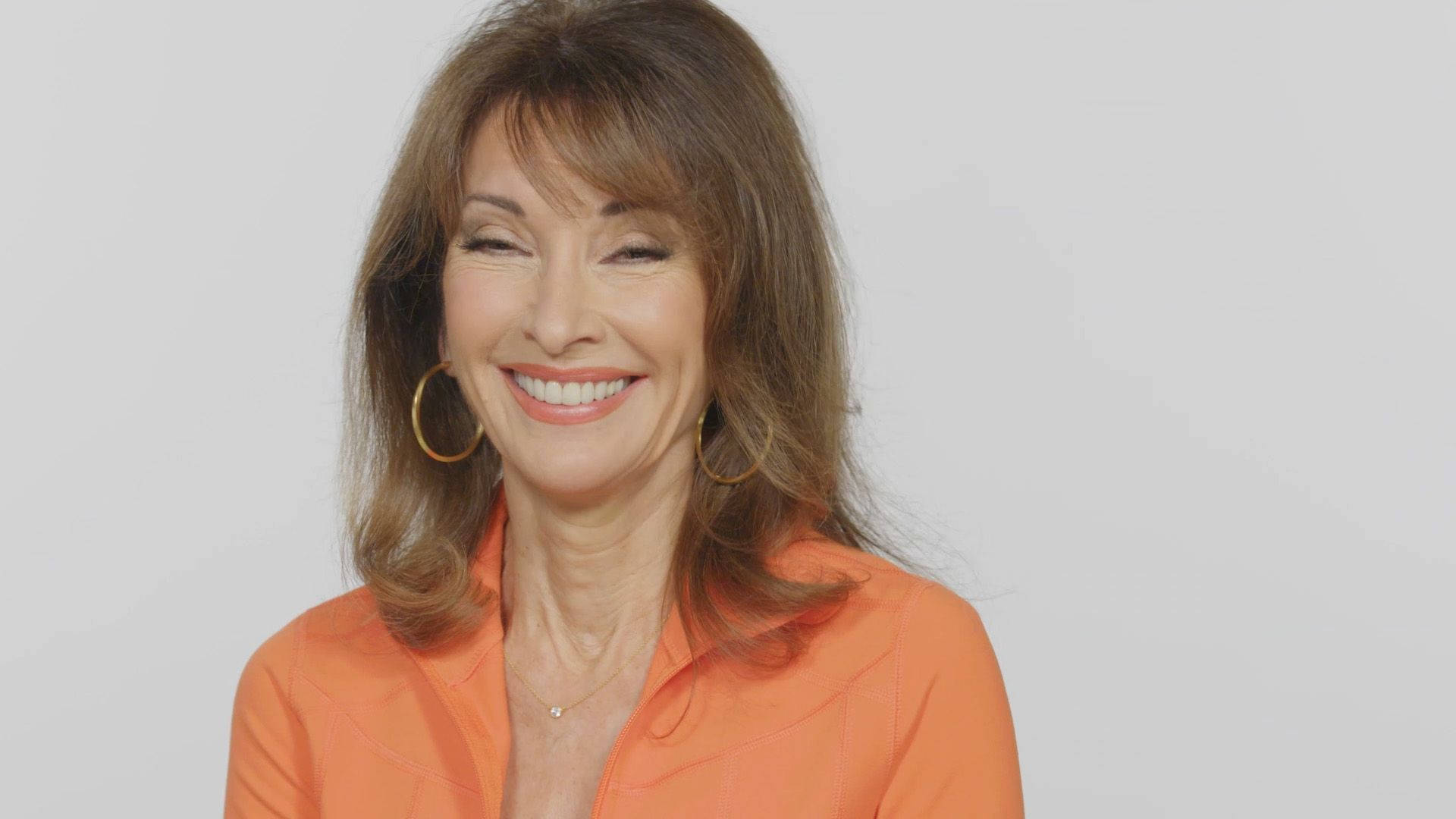 Susan Lucci, orange blouse, gold hoop earrings, Full HD Desktop Wallpaper