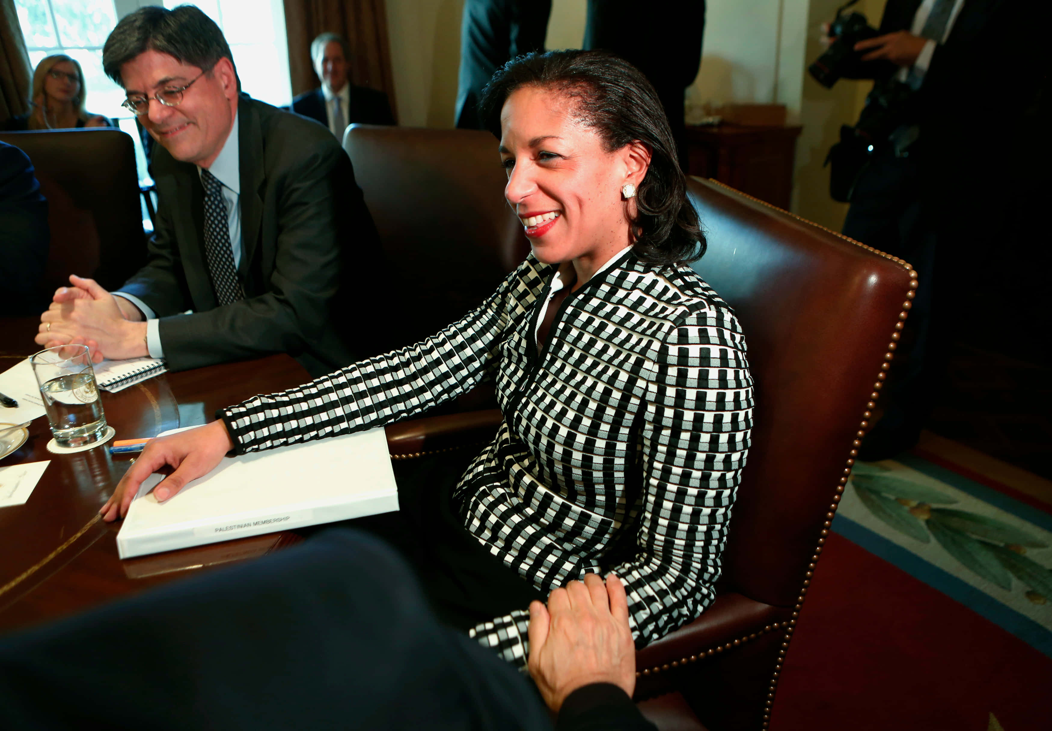 Susan Rice, black and white checkered suit, wooden table, 2K Desktop Wallpaper