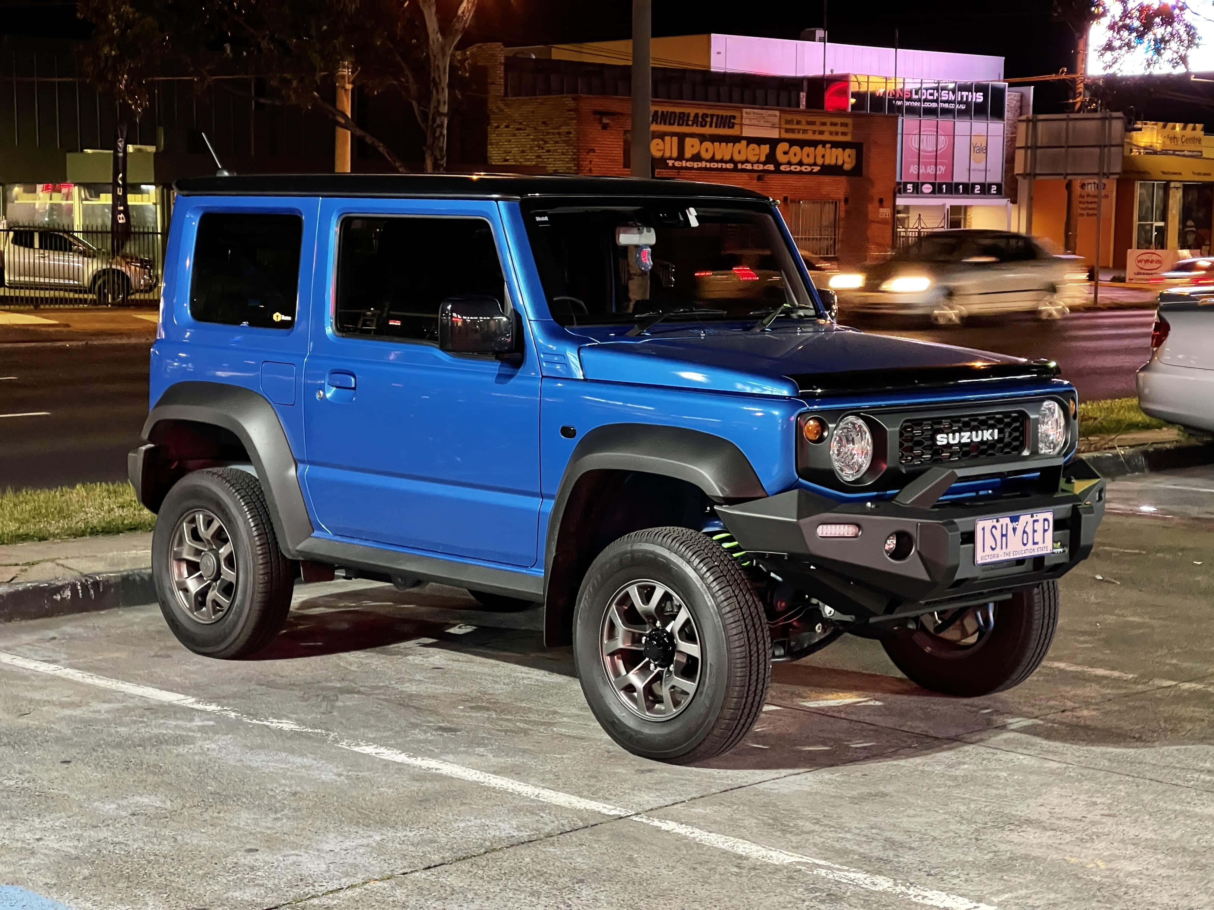 Suzuki Jimny, vibrant blue, urban lot, 4K Desktop Wallpaper