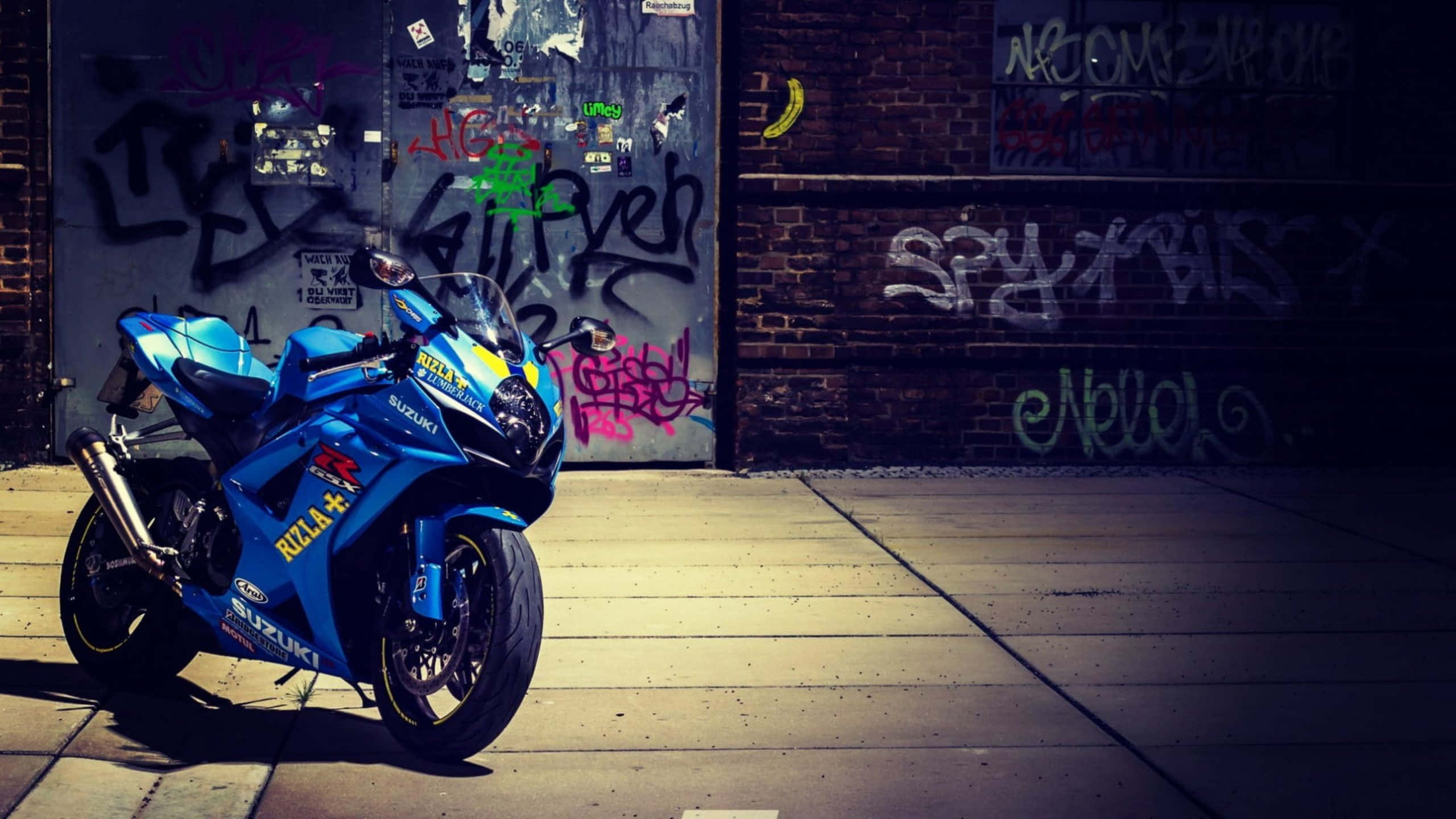 Suzuki Motorcycle, vibrant blue, sunlit concrete sidewalk, 2K Desktop Wallpaper