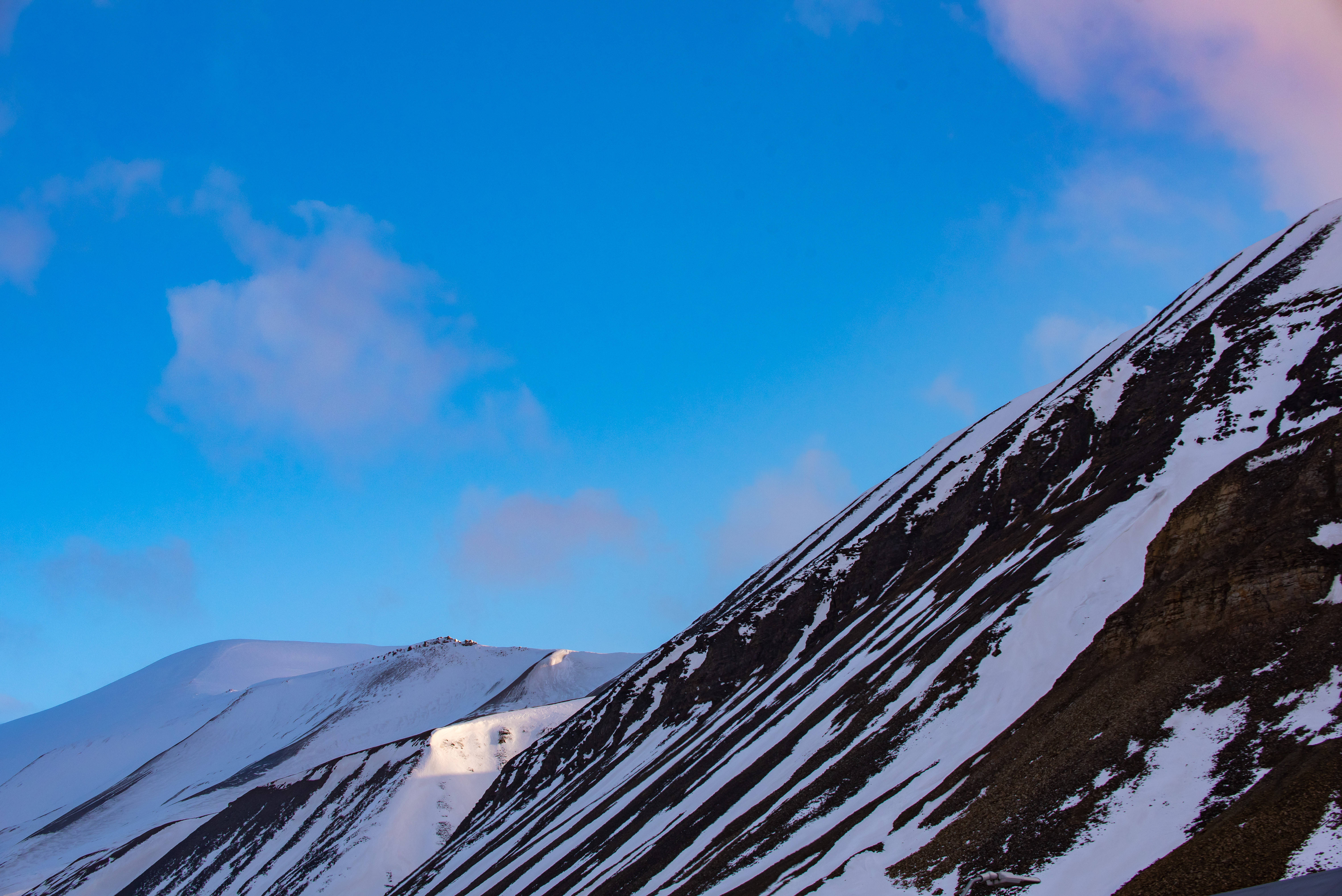 Svalbard, snowy brown mountain, vibrant blue sky, 5K Desktop Wallpaper