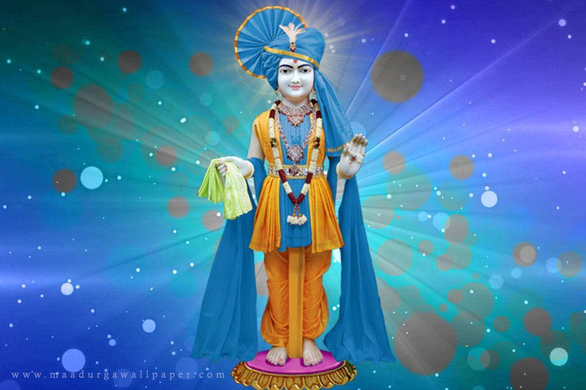 Swaminarayan, blue and gold attire, pink pedestal, SD Desktop Wallpaper