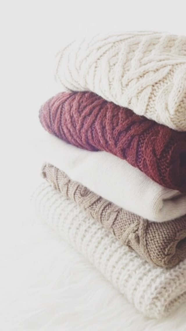 minimalistic stacked and folded sweaters, cream, burgundy, SD Phone Wallpaper
