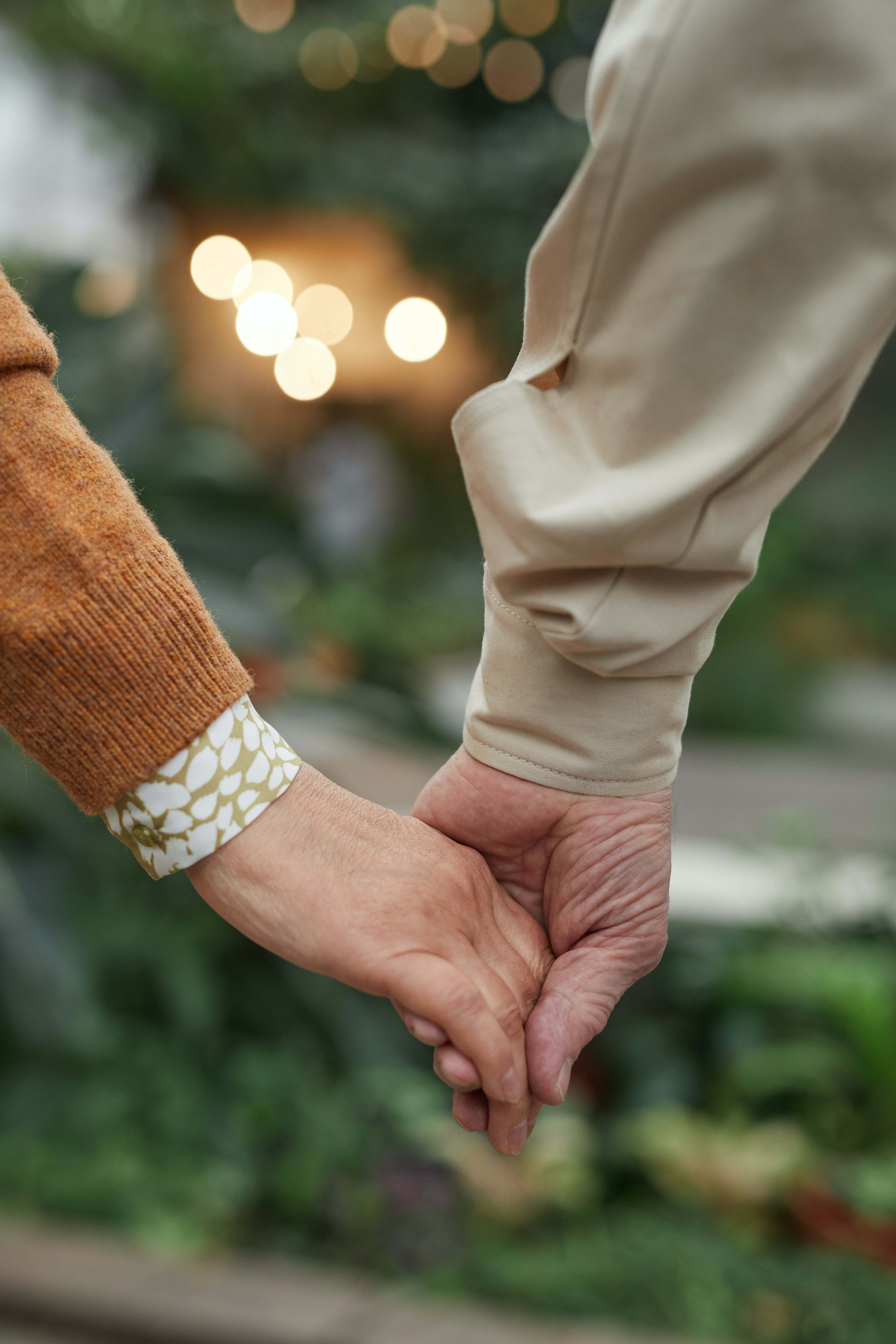 Generous Hands Of A Sweet Couple, garden backdrop, warm bokeh lights, 5K Phone Wallpaper