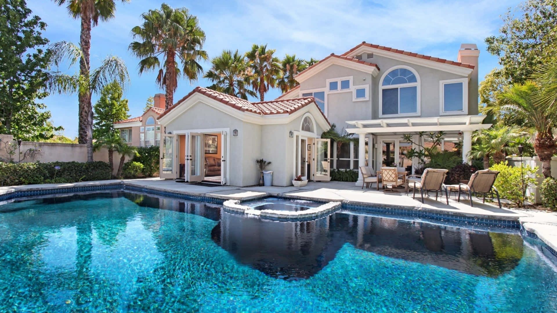 Mediterranean-style villa, sparkling blue pool, palm trees, Full HD Desktop Wallpaper