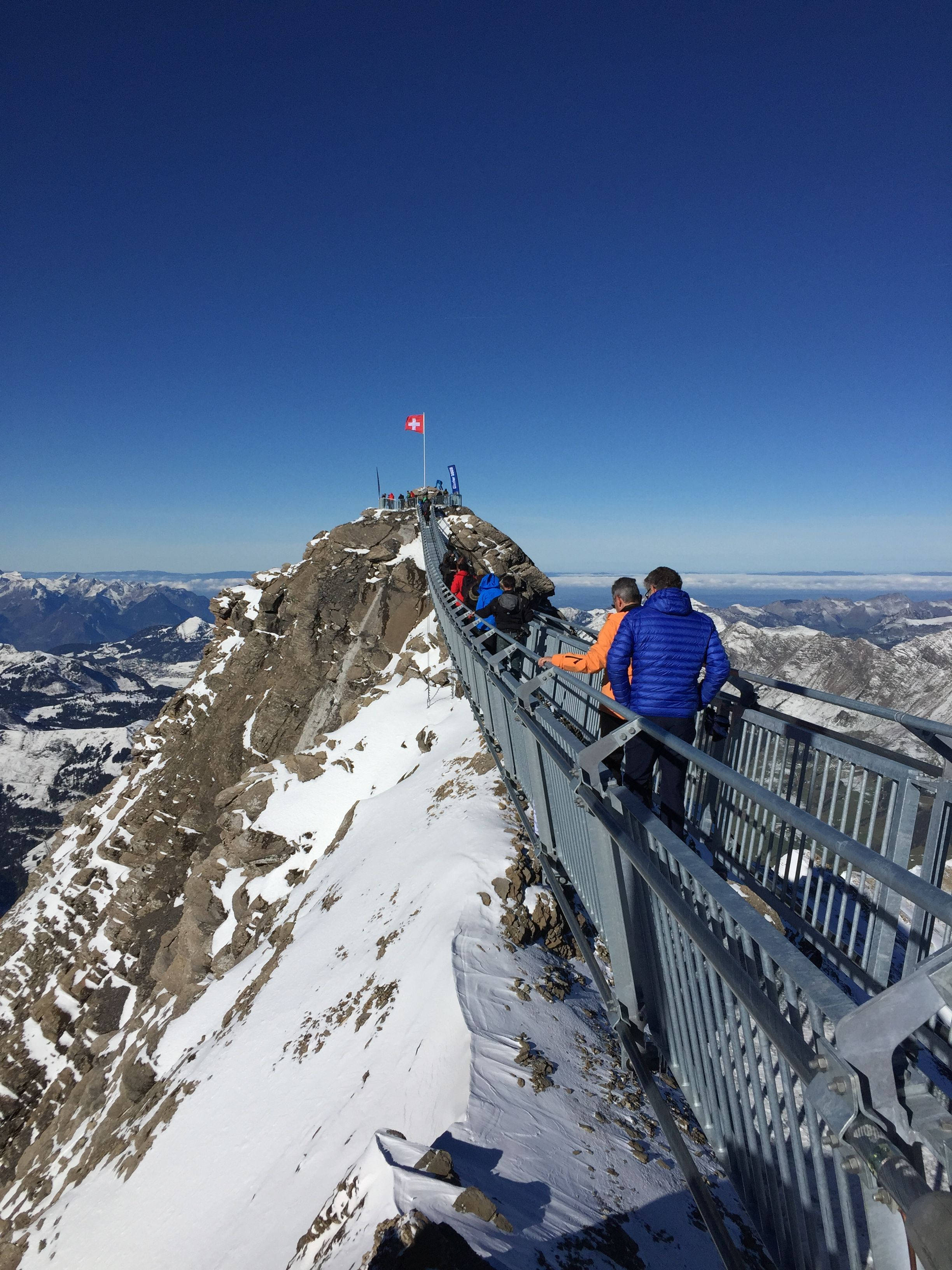Swiss Alps, metal bridge, snow-dusted mountain ridge, 2K Phone Wallpaper