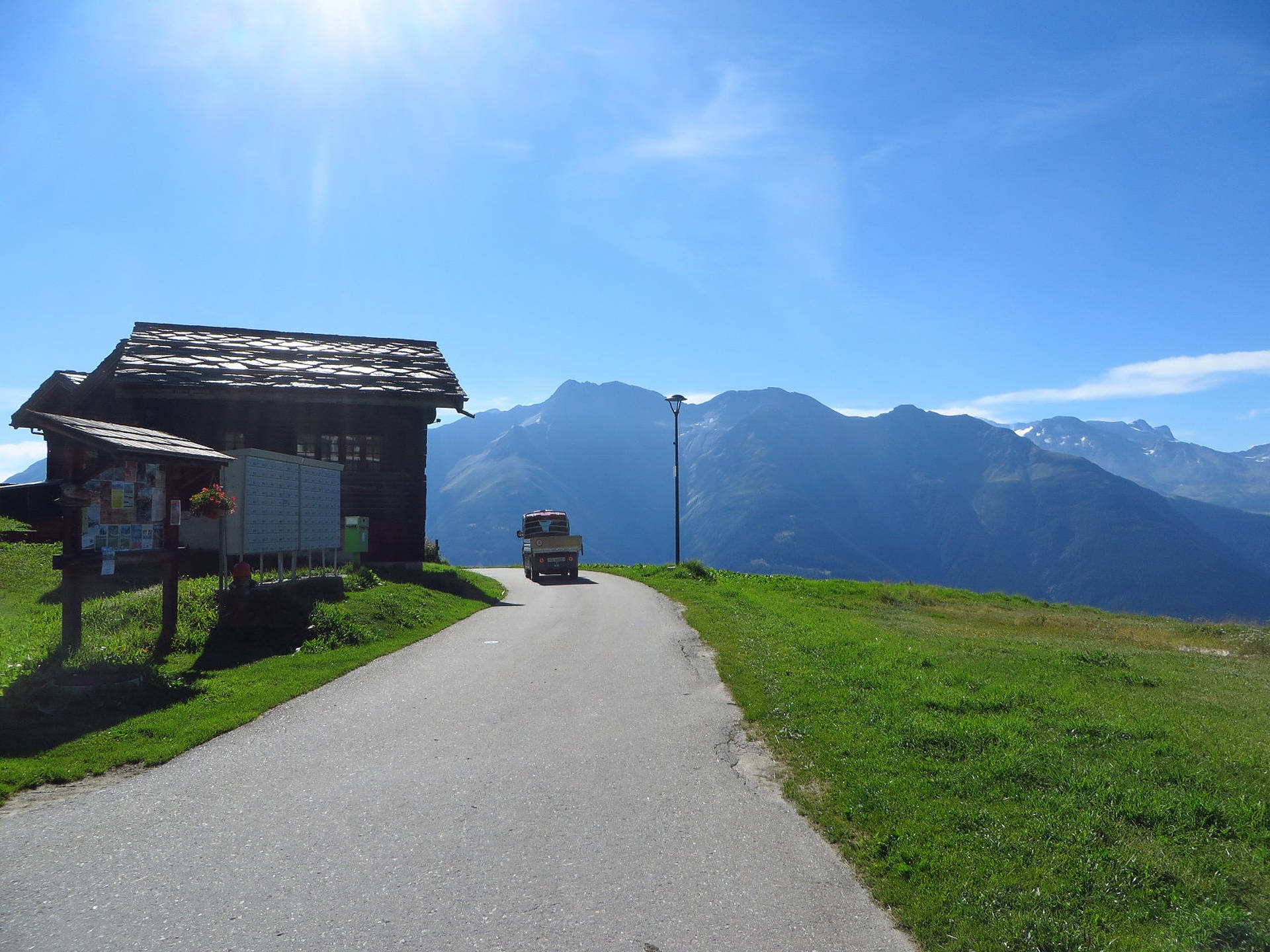 Swiss Alps, winding mountain road, wooden cabin, Full HD Desktop Wallpaper