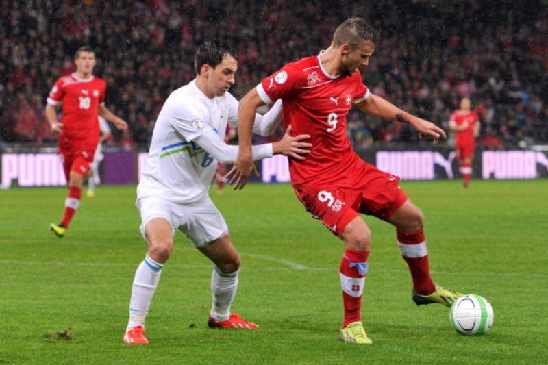 Switzerland National Football Team, soccer players, rain-slicked pitch, SD Desktop Wallpaper