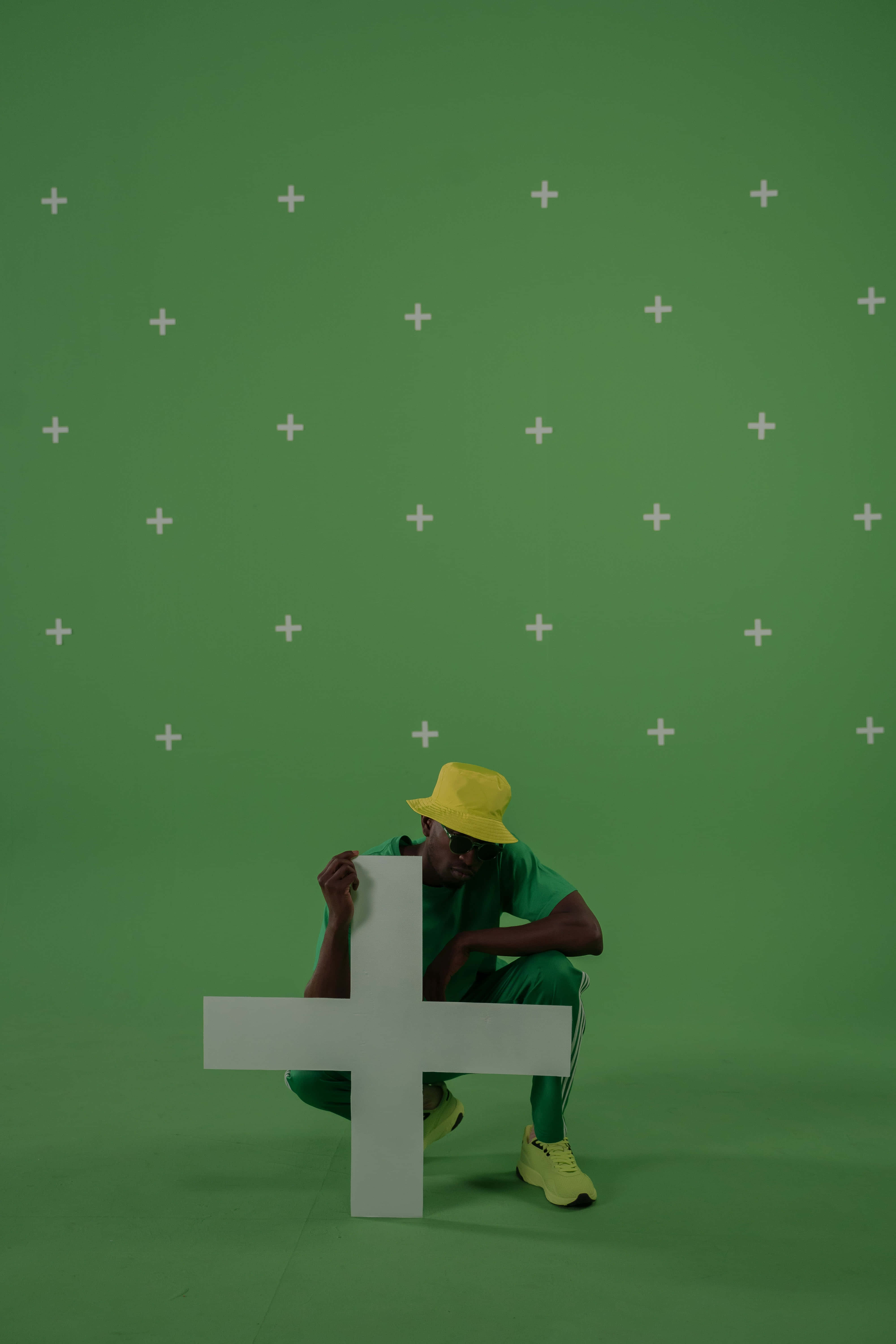 green screen set up, large white plus sign, green wall, 5K Phone Wallpaper