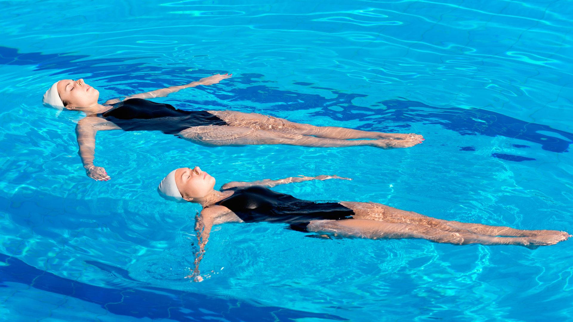 synchronized float on water artistic swimming, black swimsuits, white caps, Full HD Desktop Wallpaper