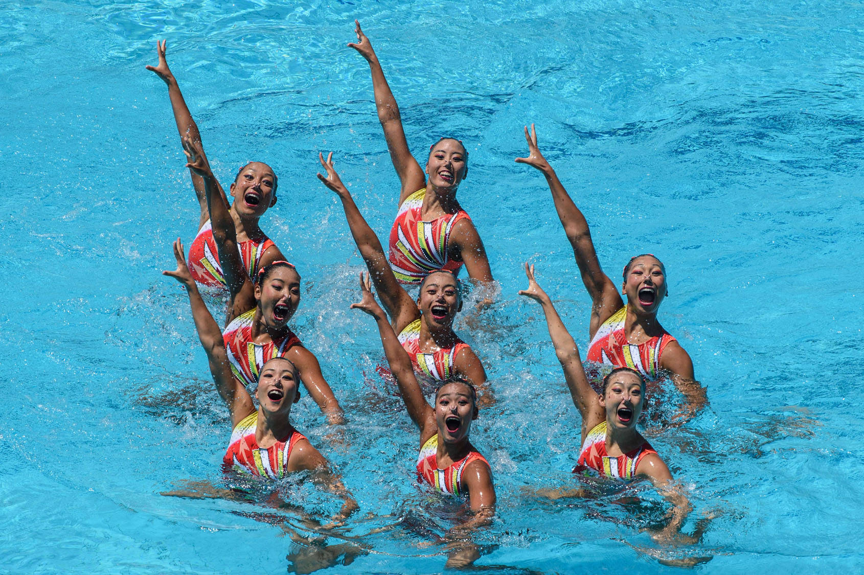 Synchronized Swimming, colorful striped suits, vibrant blue water, HD Desktop Wallpaper