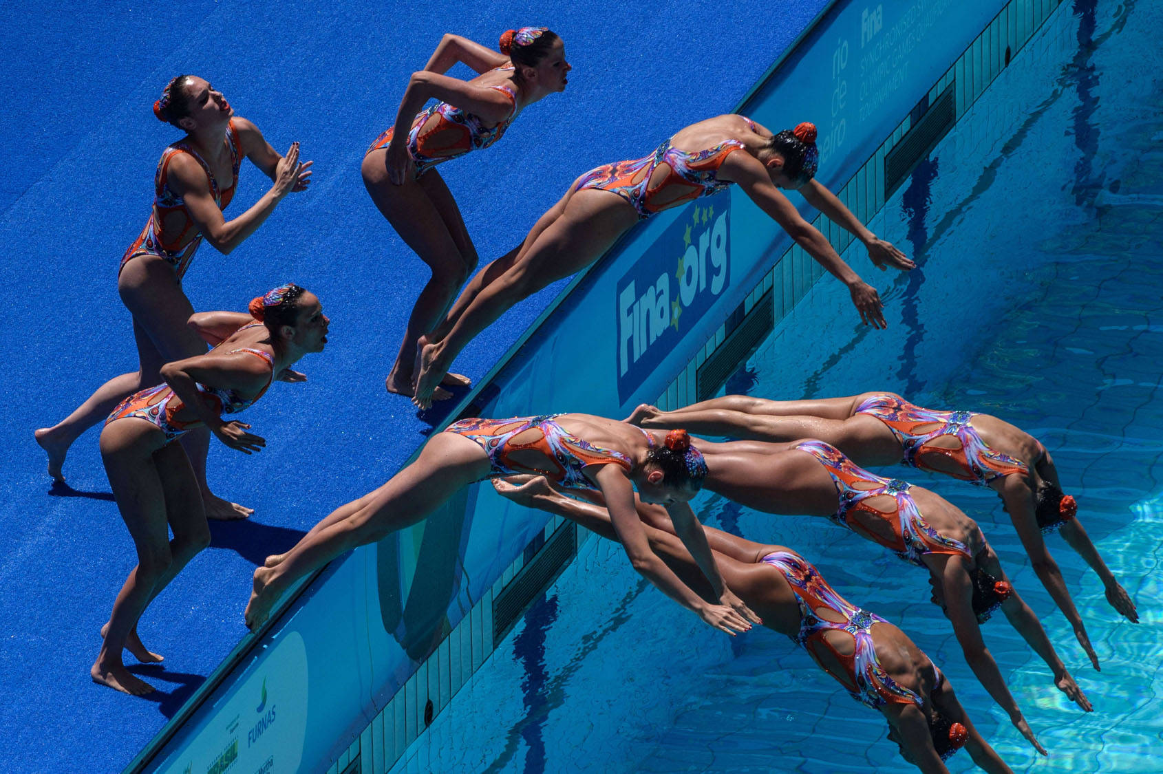 Synchronized Swimming, vibrant orange, blue costumes, HD Desktop Wallpaper