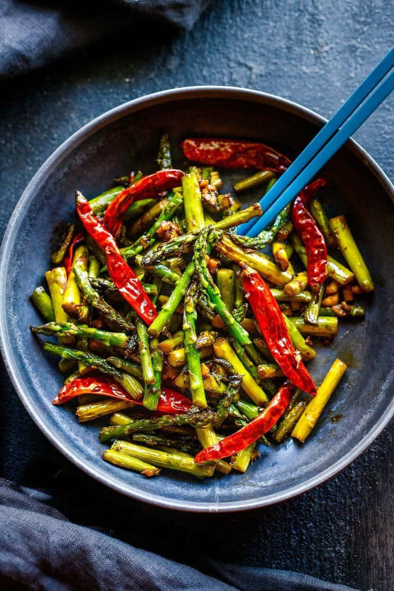 Szechuan Sauce, dark bowl, vibrant green asparagus spears, SD Phone Wallpaper