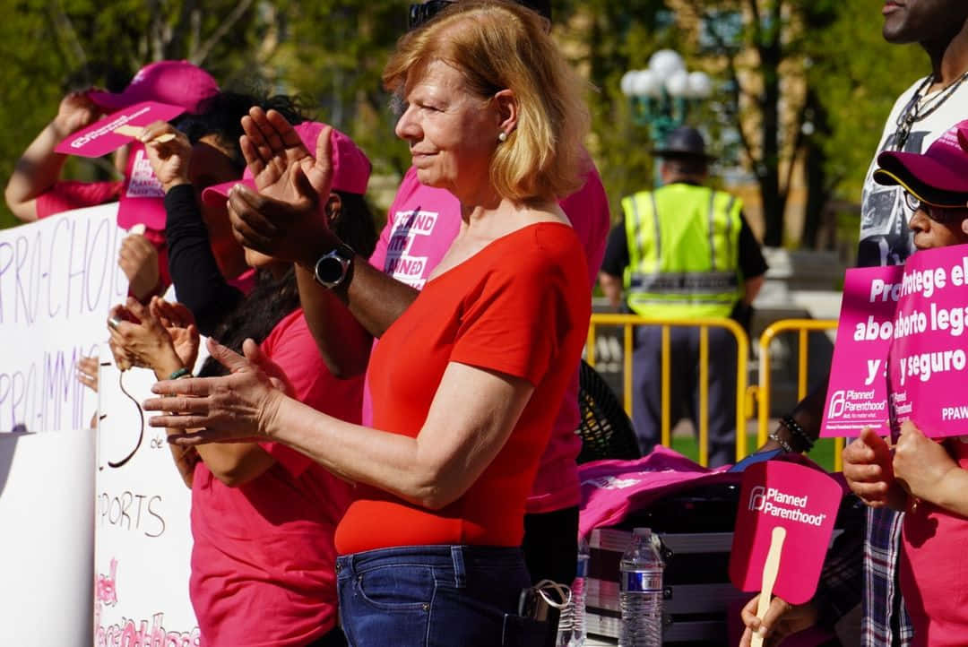 Tammy Baldwin, pro-choice rally, red shirt, SD Desktop Wallpaper
