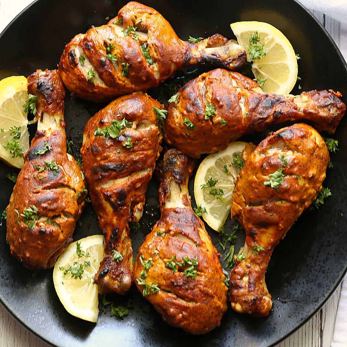 Roasted Chicken Tandoori Legs, golden-brown grilled chicken drumsticks, fresh parsley, SD Desktop Wallpaper