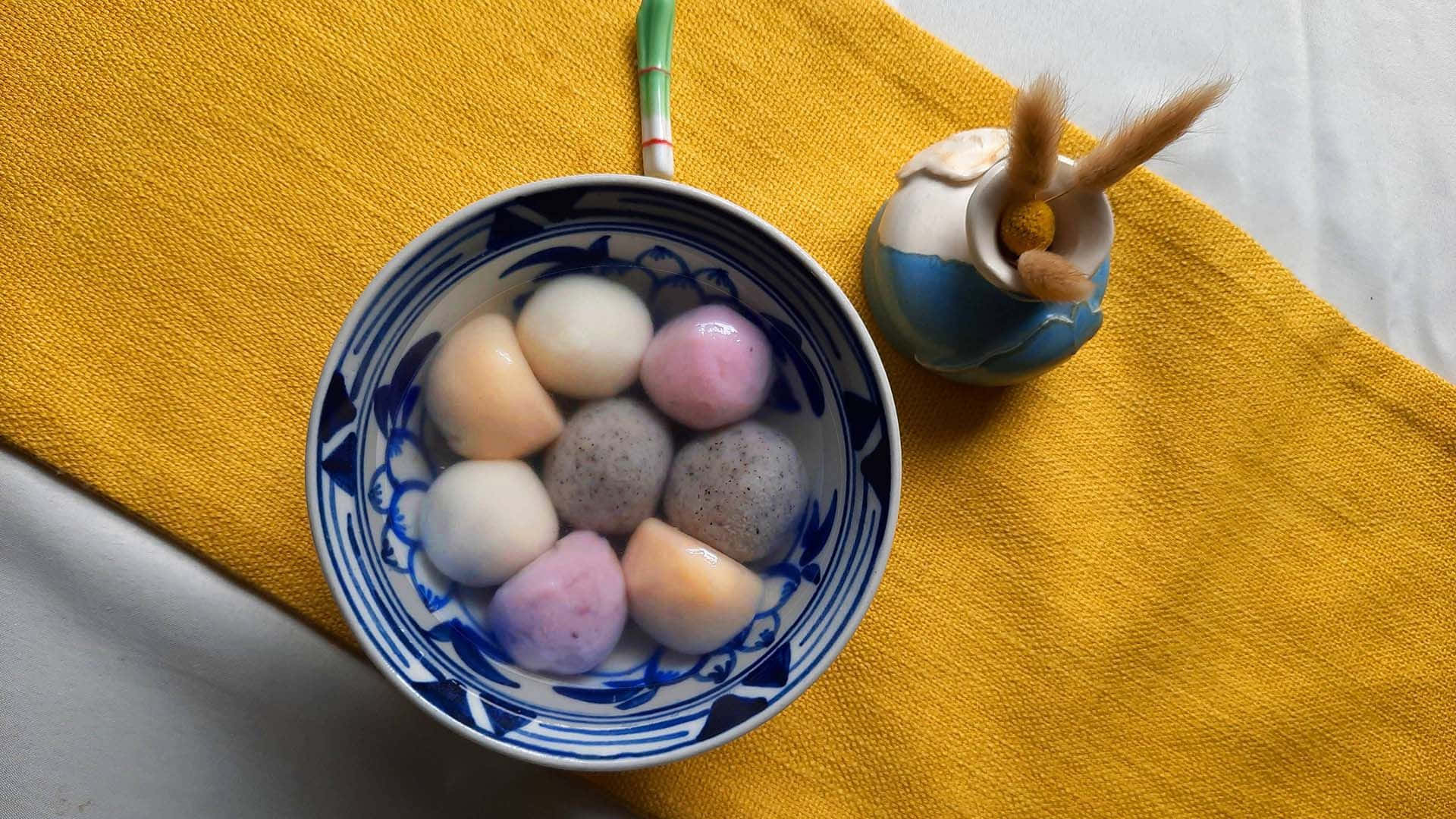 blue and white patterned bowl, colorful mochi balls, textured yellow cloth, Full HD Desktop Wallpaper