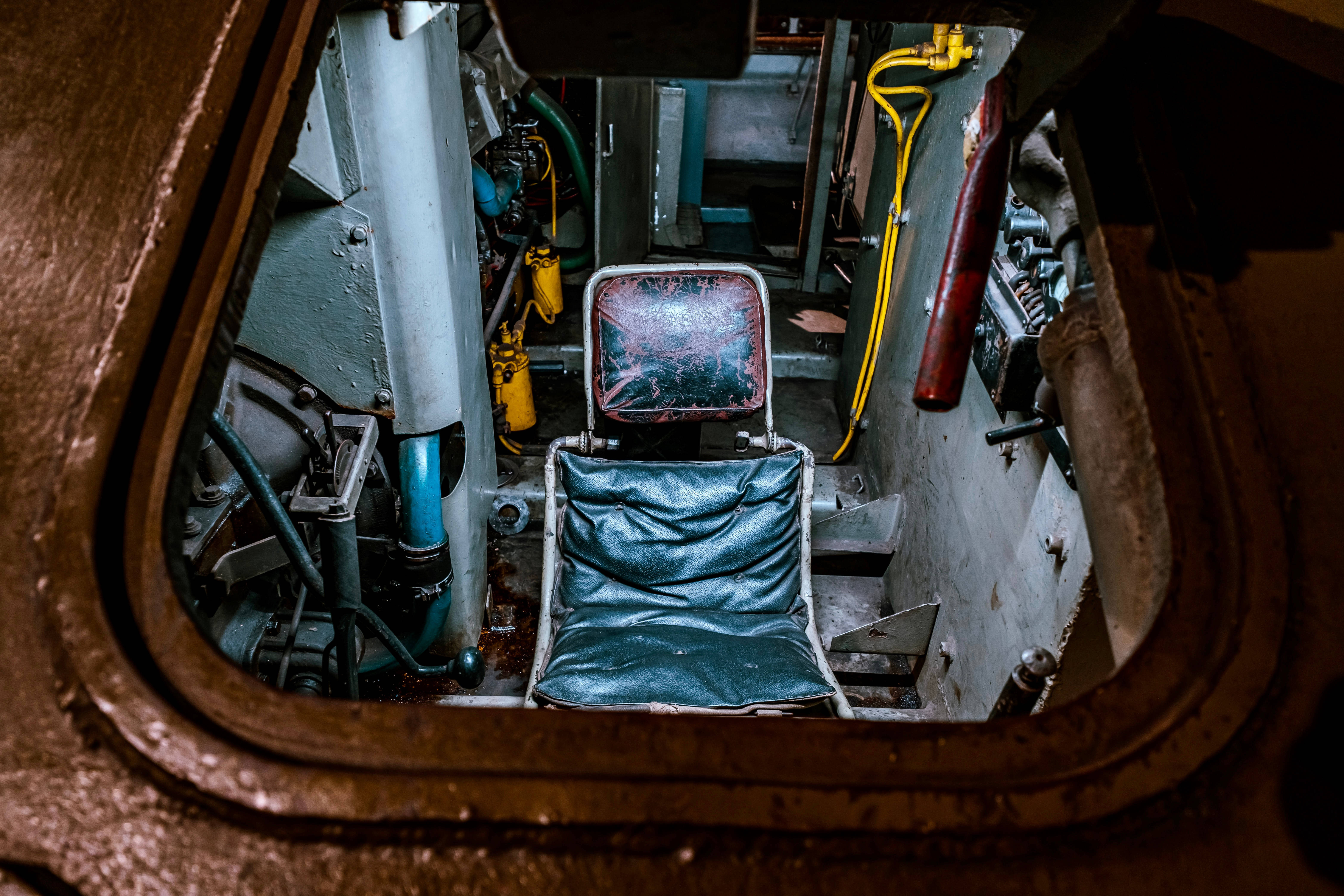 teal captain's chair, rusty metal hatch, old submarine control room, 5K Desktop Wallpaper