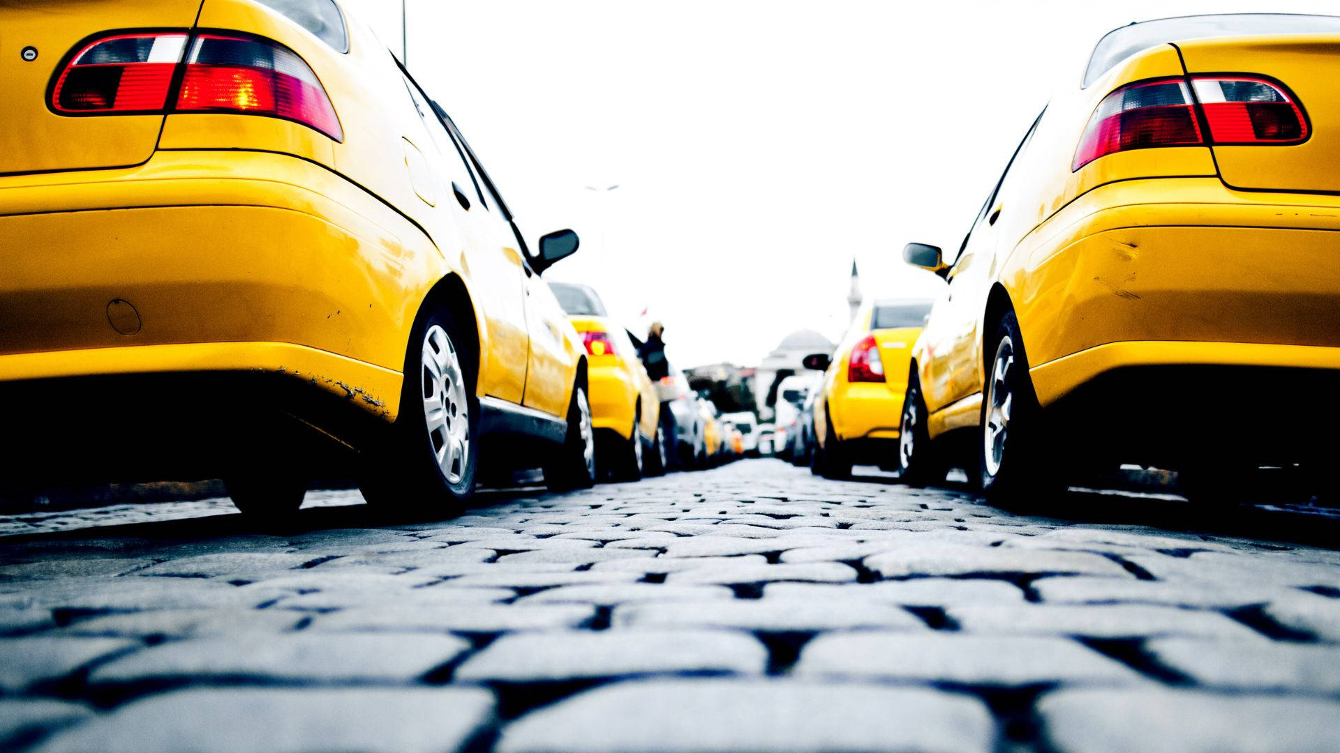 yellow taxi, low angle, cobblestone street, Full HD Desktop Wallpaper