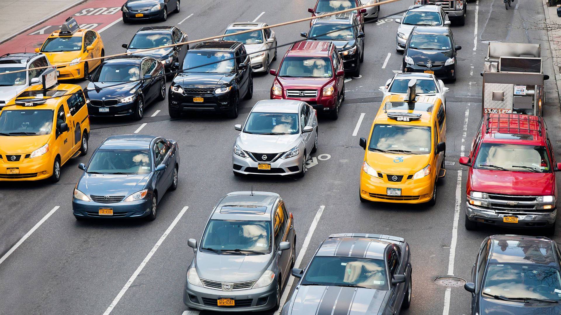 yellow taxis, multi-lane city street, dense urban traffic, Full HD Desktop Wallpaper