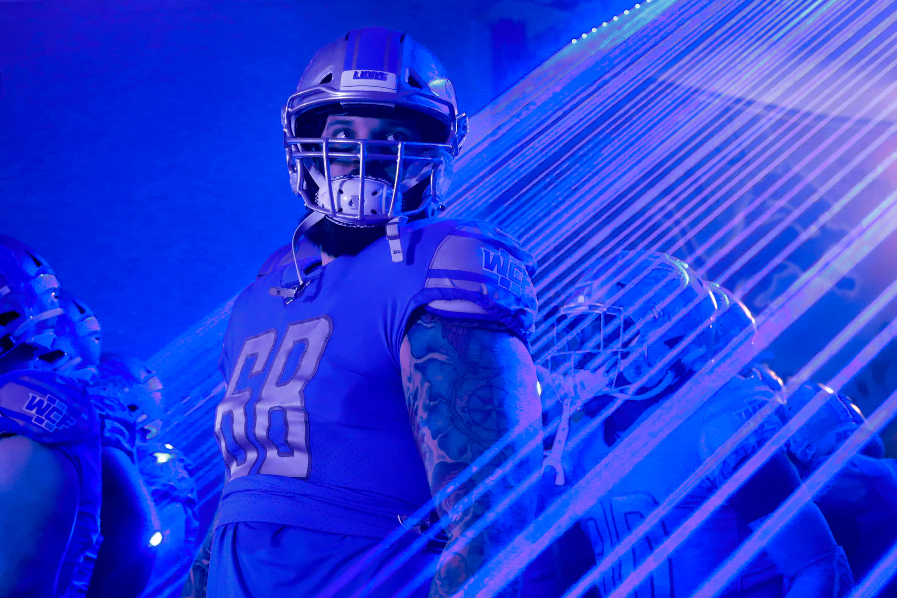 Taylor Decker, blue gear, dramatic blue stage lights, 2K Desktop Wallpaper