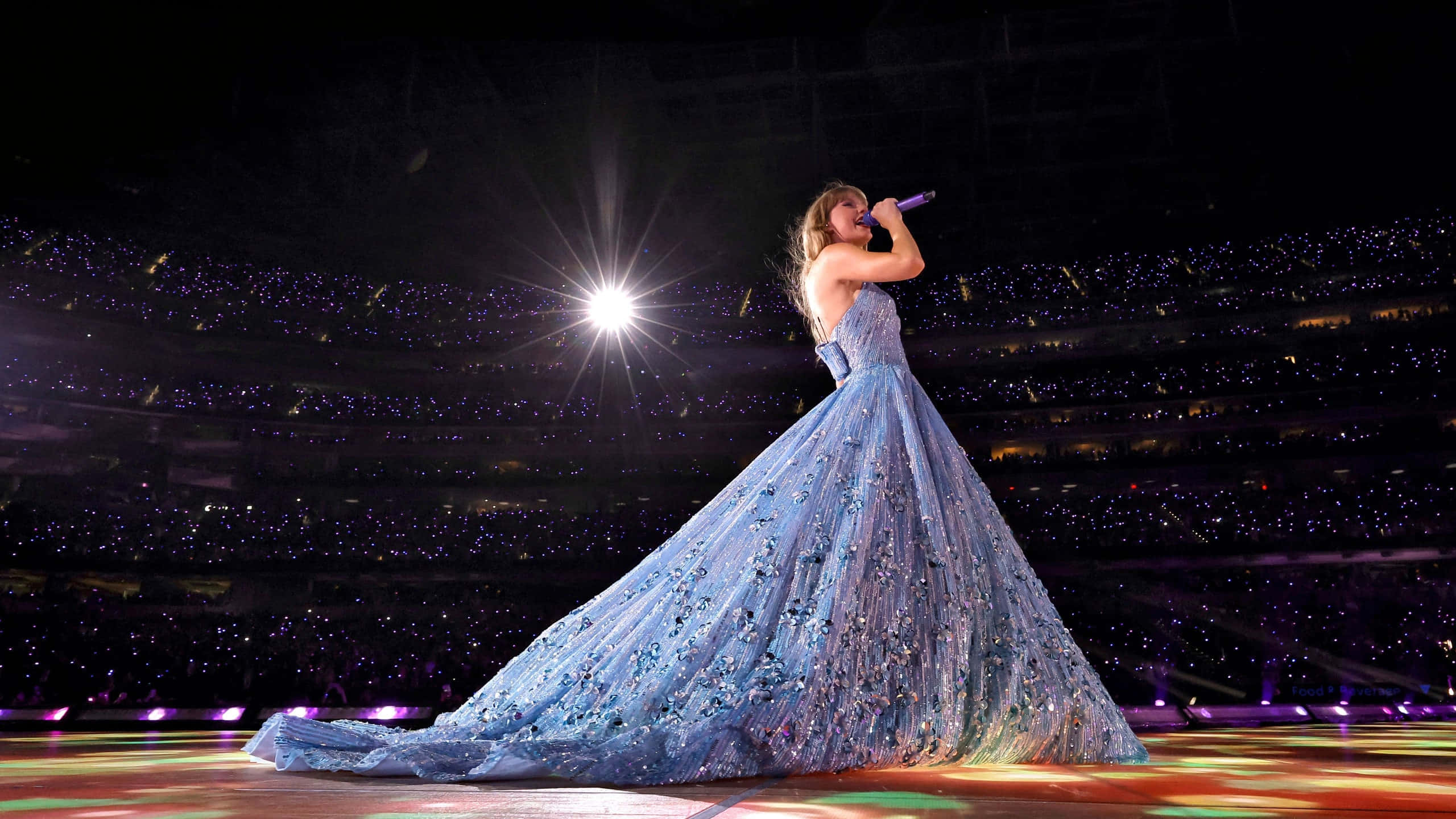 Taylor Swift Eras Tour, sparkling blue gown, brightly lit stage, 2K Desktop Wallpaper