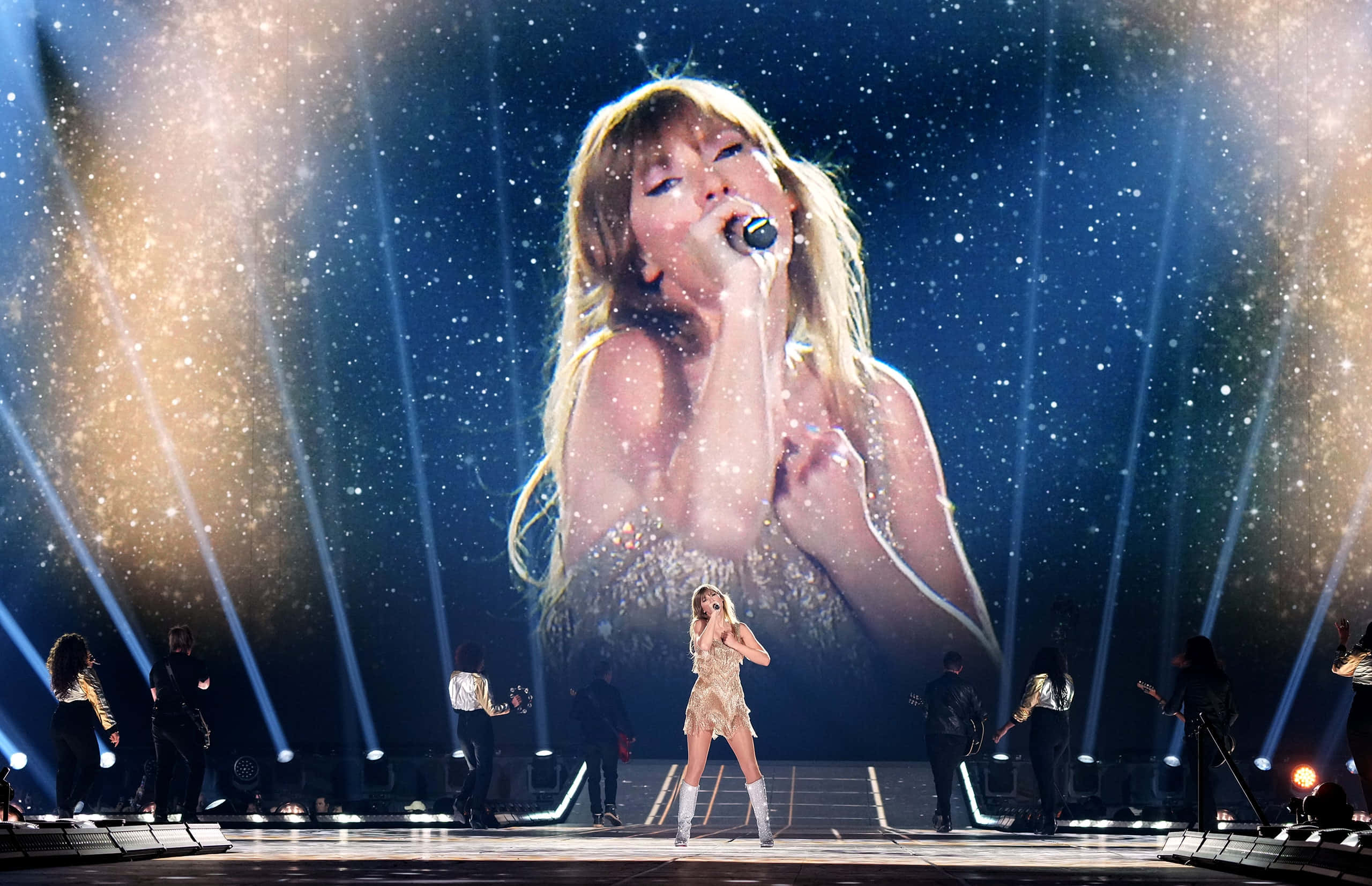 Taylor Swift Eras Tour, glittering stage, dramatic spotlights, 2K Desktop Wallpaper