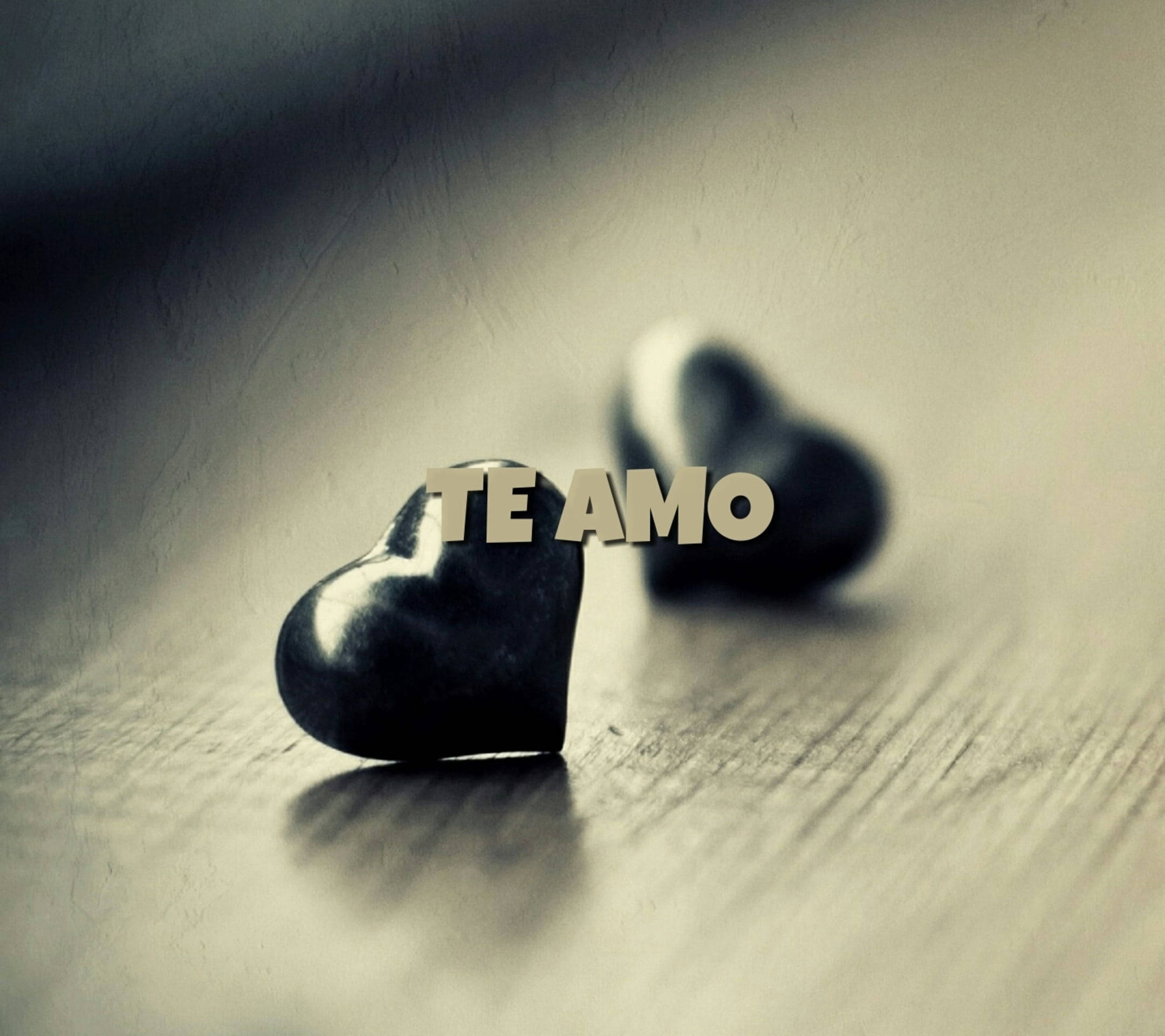 Monochromatic Te Amo, glossy black heart-shaped stones, wooden surface, Full HD Desktop Wallpaper
