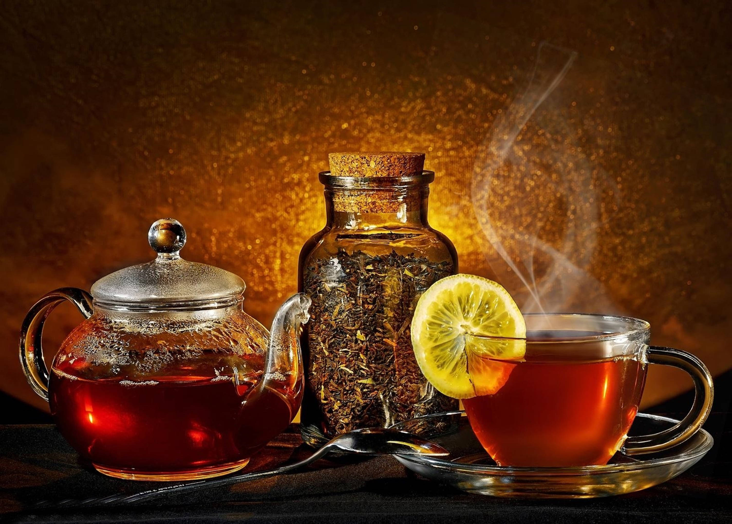 Tea Garden, steaming glass teapot, cup of rich amber tea, 2K Desktop Wallpaper