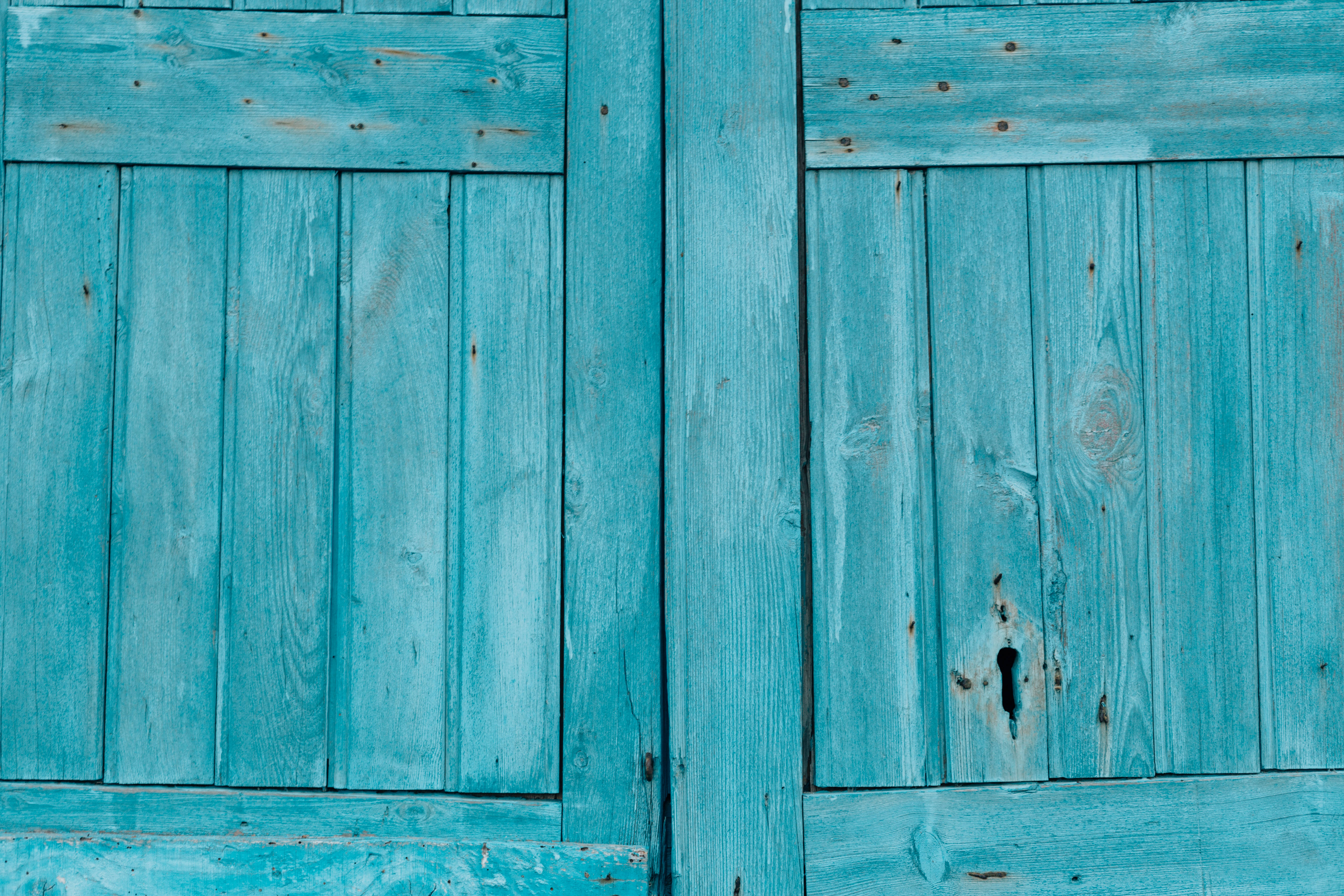 wooden teal door, weathered turquoise wooden shutters, visible grain knots, 5K Desktop Wallpaper