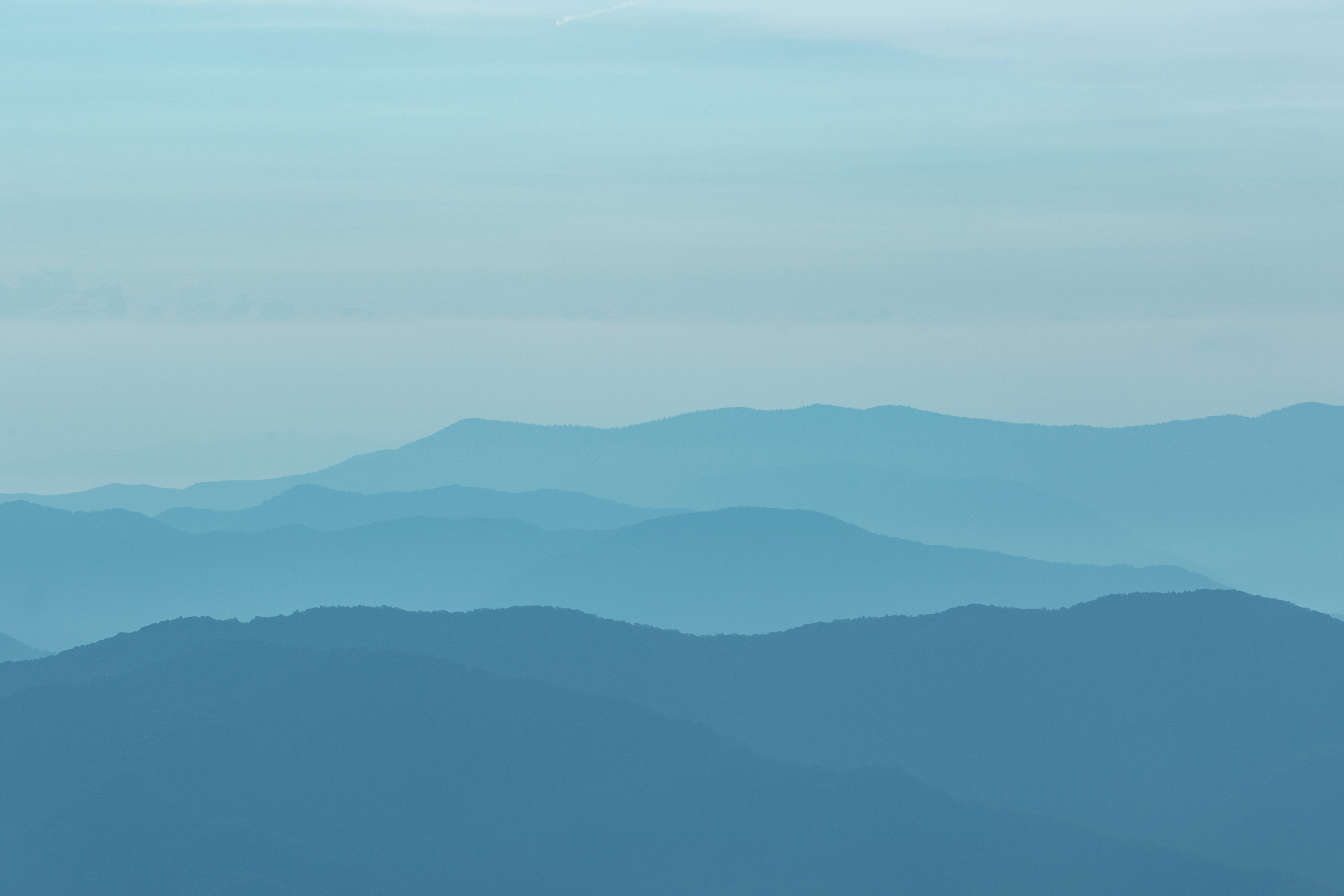 ombre blue teal mountain, layered mountain ranges, misty blue haze, 5K Desktop Wallpaper