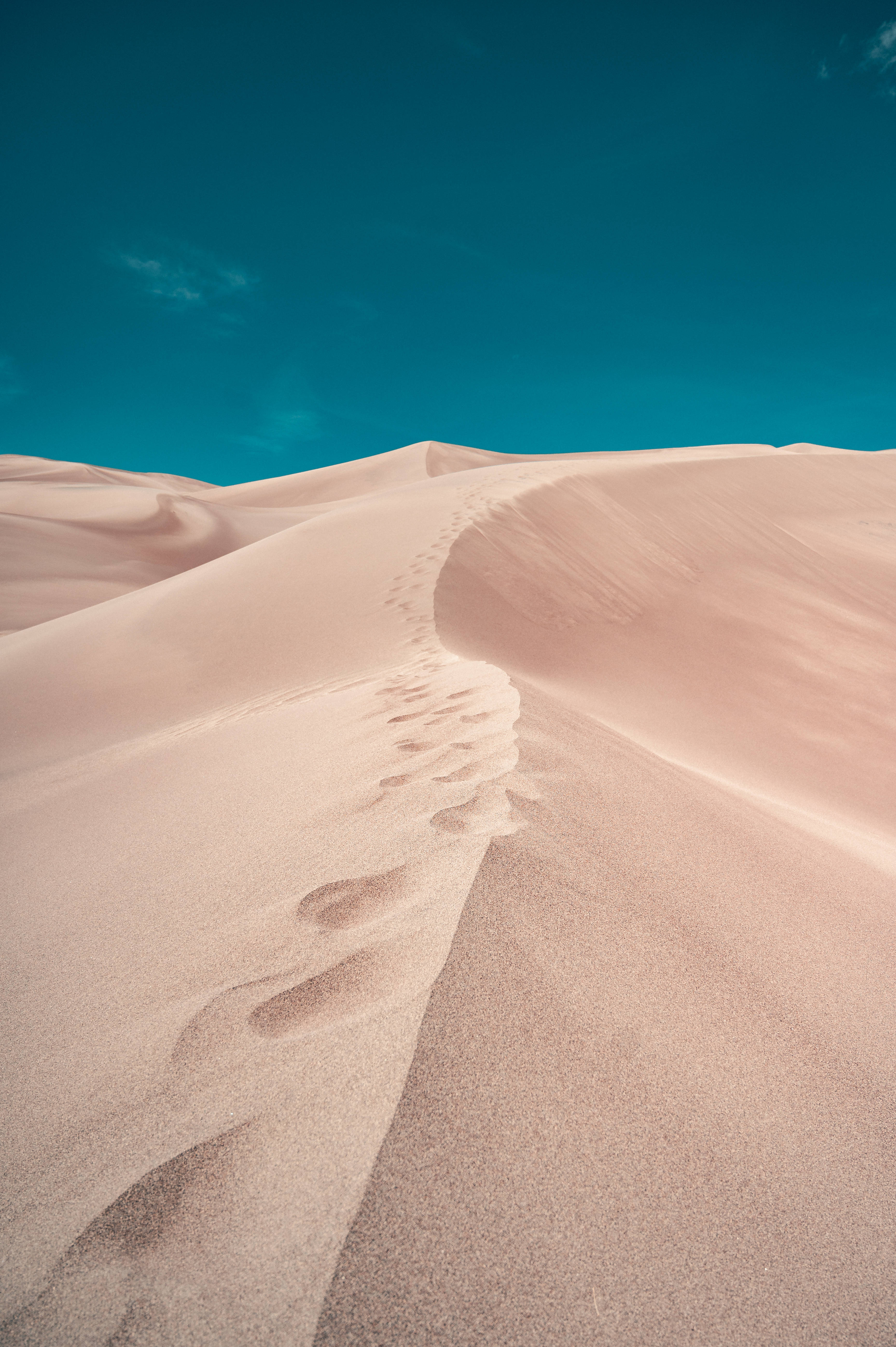 teal sky, pink sand dune, footprints, 5K Phone Wallpaper