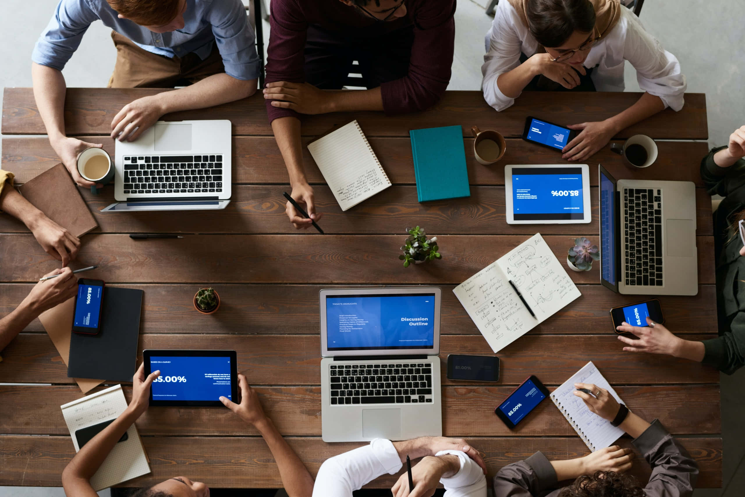 Commercial Team Meeting, overhead view, diverse professionals, 2K Desktop Wallpaper