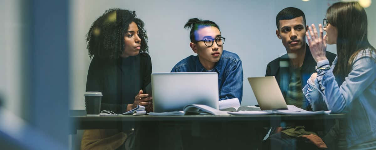 young group session, glass-walled meeting table, laptops, SD Desktop Wallpaper