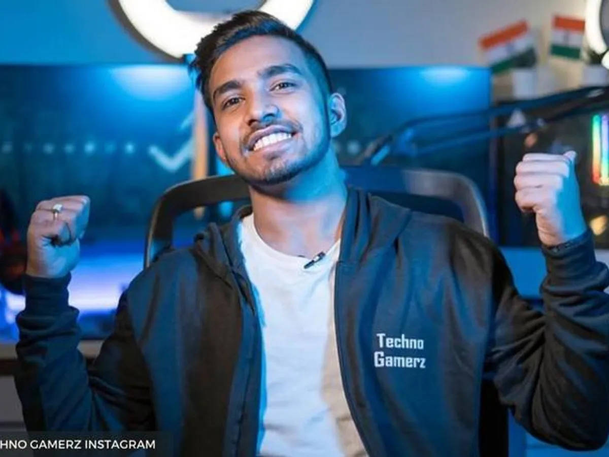 Techno Gamerz, hoodie, blue-lit gaming setup, SD Desktop Wallpaper