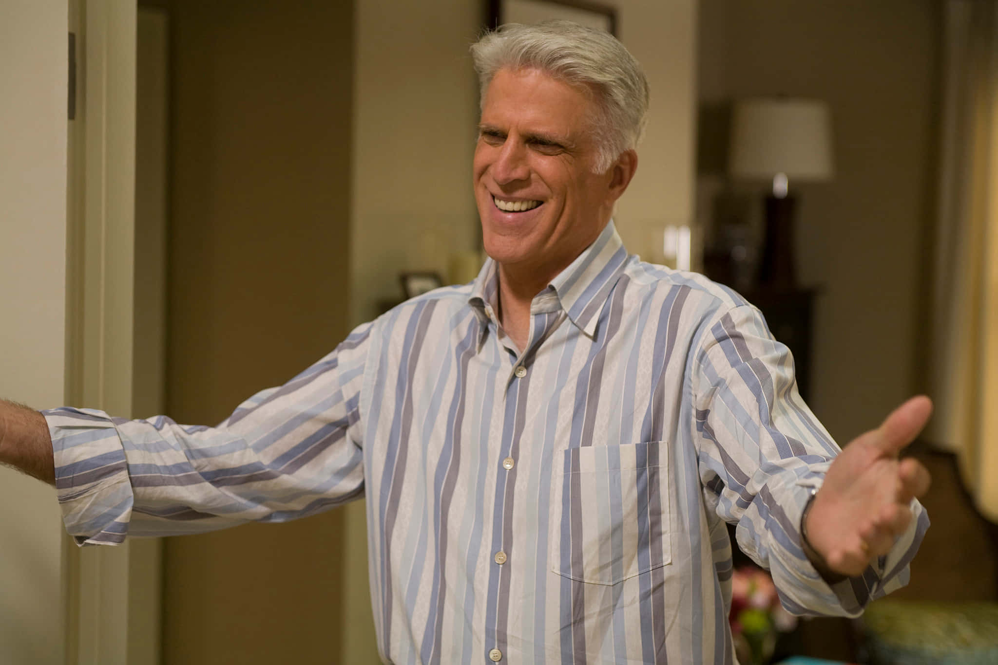 Ted Danson, striped shirt, warmly lit indoor room, Full HD Desktop Wallpaper
